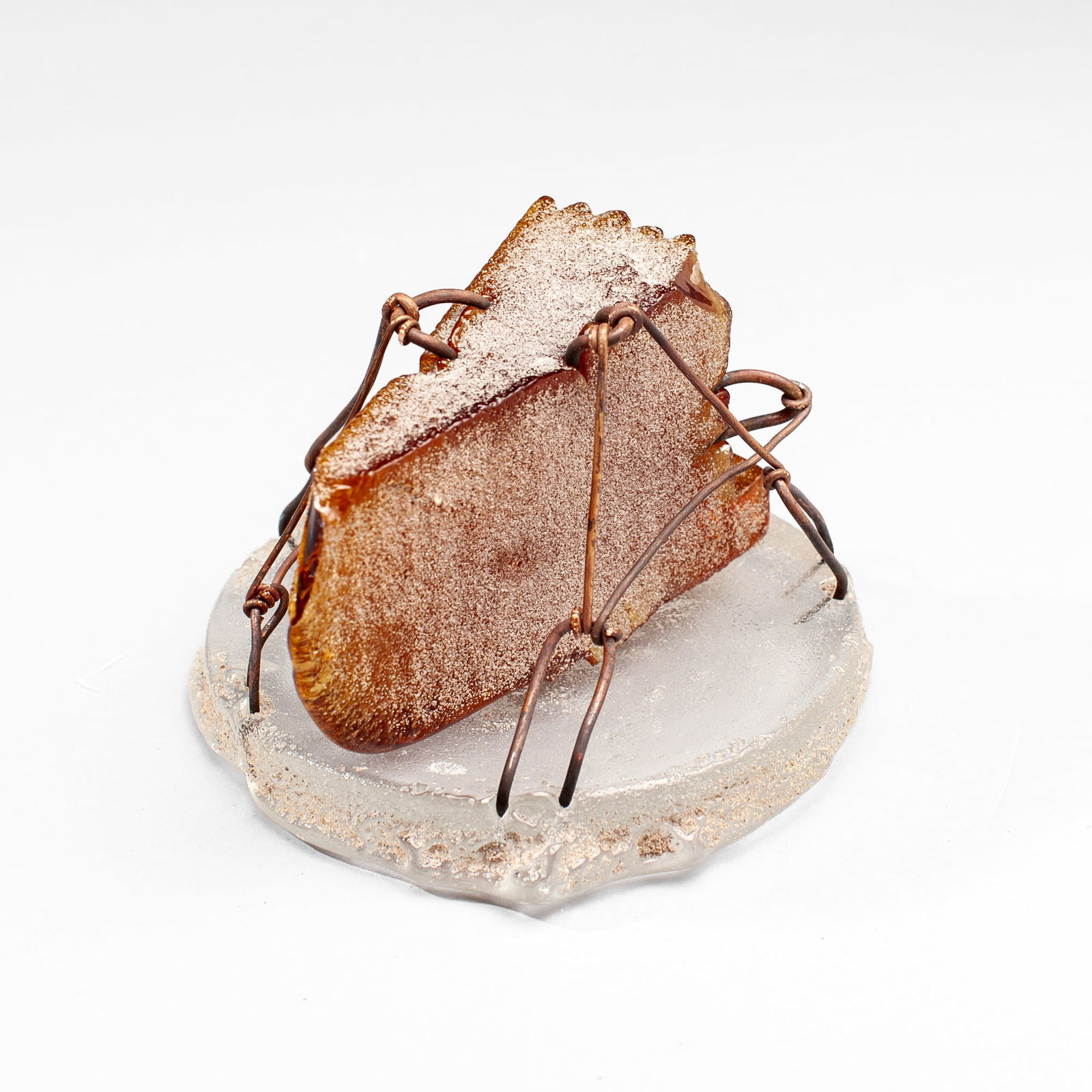 Hank Murta Adams "Small Slice of Cake": Hank Murta Adams (b.1956 New Jersey) "Small Slice of Cake" Mixed Media Glass Sculpture, 1998. Signed and dated on base. Cast glass, copper wire, and sand. Measures 4.5x6". Collection of Marge Levy (19