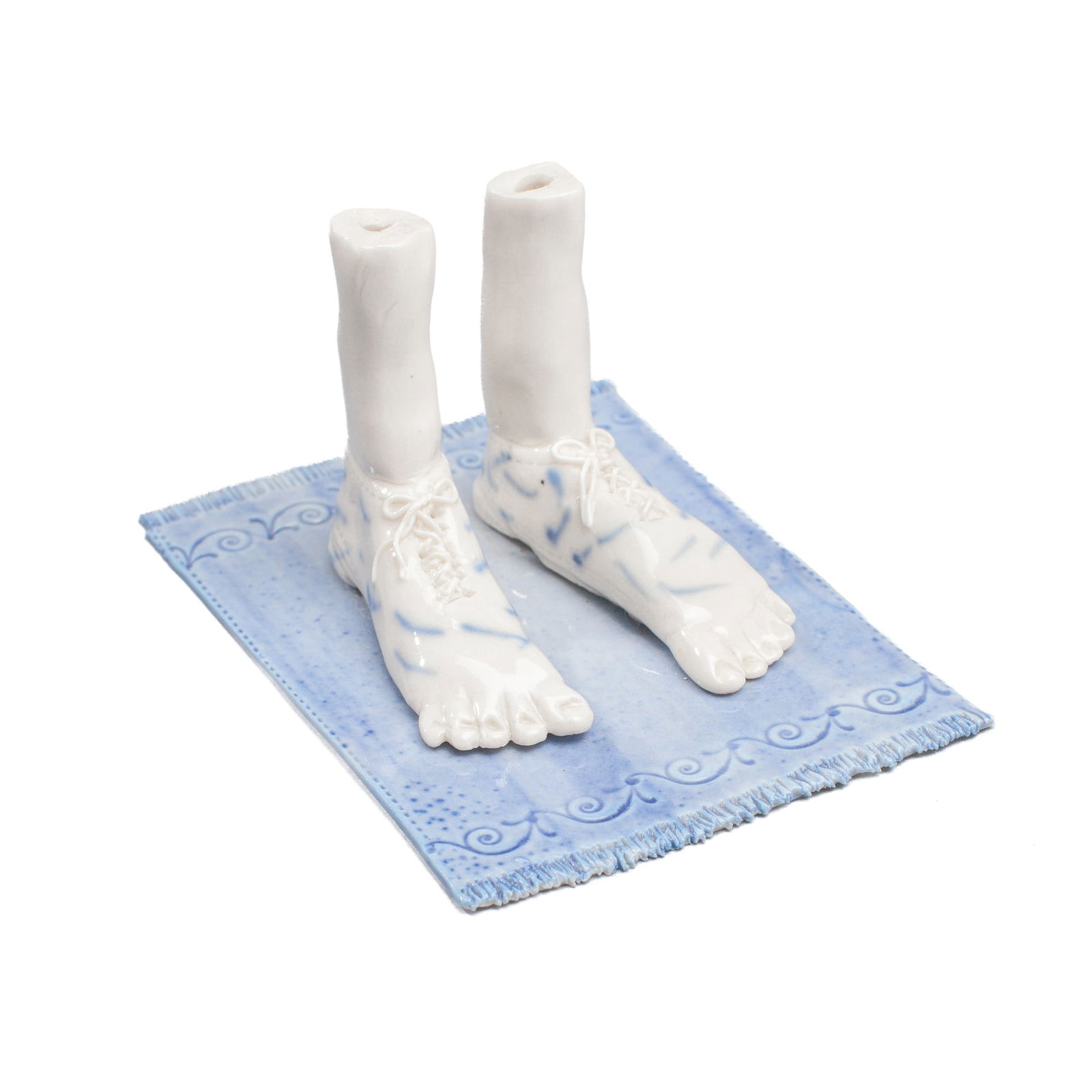 Coille Hooven "Sandy Sandals" Porcelain Sculpture: Coille Hooven (1939-2024 California) "Sandy Sandals" Porcelain Sculpture. Signed on underside. Feet with shoe laces on blue carpet; cobalt underglaze decoration. Measures 2.5x4.5x3.5". Excellent condi