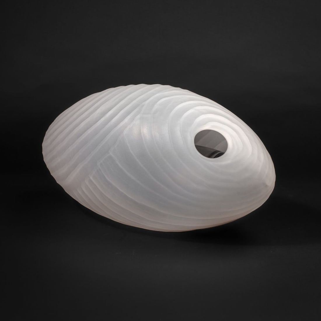 Armelle Bouchet O'Neill "Cocoon" Glass Sculpture: Armelle Bouchet O'Neill (France / Seattle) "Cocoon" blown and sand-carved art glass sculpture with blown colored glass "larva" inside. Signed. In excellent condition. 16" L x 8" W approx. Donated by t