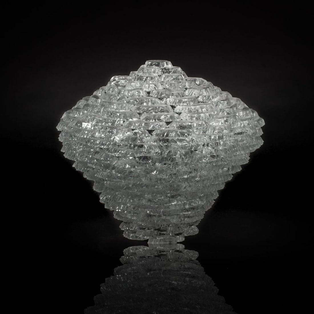 David Leight "Mochi Ball" Art Glass Sculpture: David Leight "Mochi Ball" cut and fused clear glass sculpture. Signed to base and dated 2007. Some fritting and small chips to edges of base; otherwise appears in good condition. 12" H x 13.5".