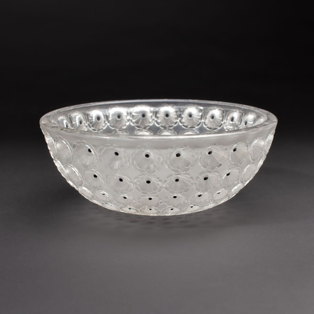 Lalique France "Nemours" Bowl: Lalique "Nemours" bowl if clear and polished glass with black enamel to center of poppy flowers. Design first introduced in 1929. Faintly discernible "R. LALIQUE" signature at base. In very good condi