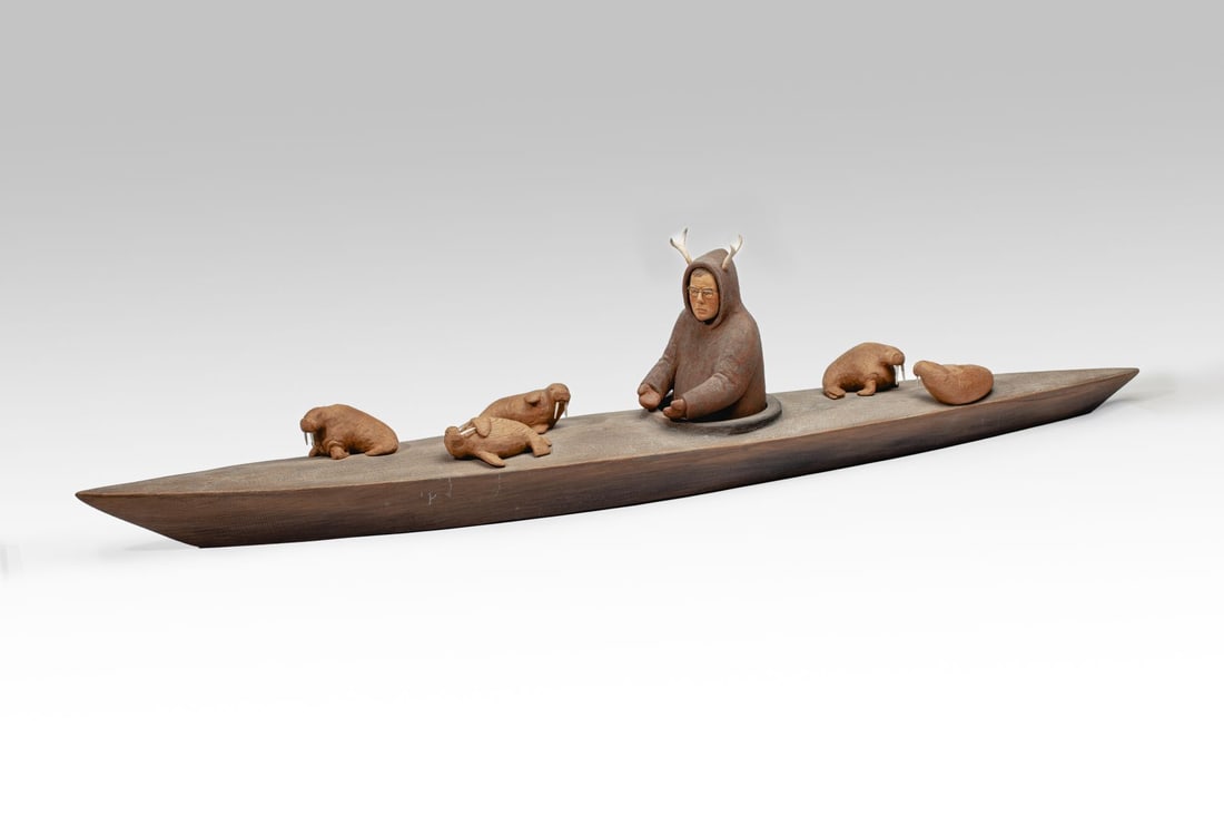 Brent Gelaude Kayaking Man Cedar Sculpture: Brent Gelaude (b. 1956 Canada / Vancouver BC) carved and painted cedar wood, bone and metal wire sculpture depicting man piloting kayak with lounging walruses. Possibly a custom portrait. Pyrographic