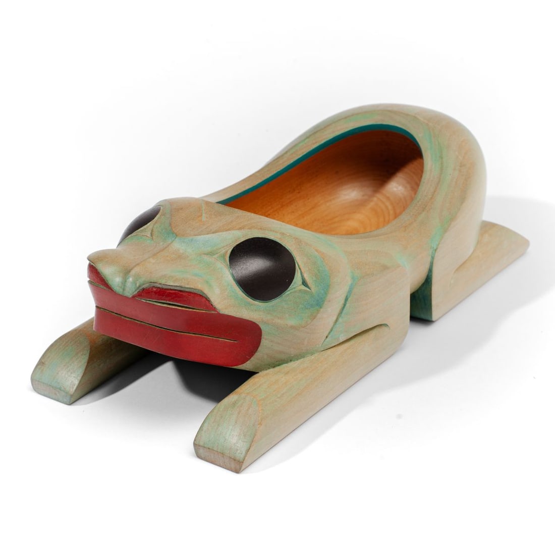 Kendall J. Mowatt NW Coast Grease Bowl: Northwest Coast Native American hand carved wood frog form grease bowl with green stain / paint washed surface. Red / black painted details. Carved KENDALL J. MOWATT signature to underside. Good