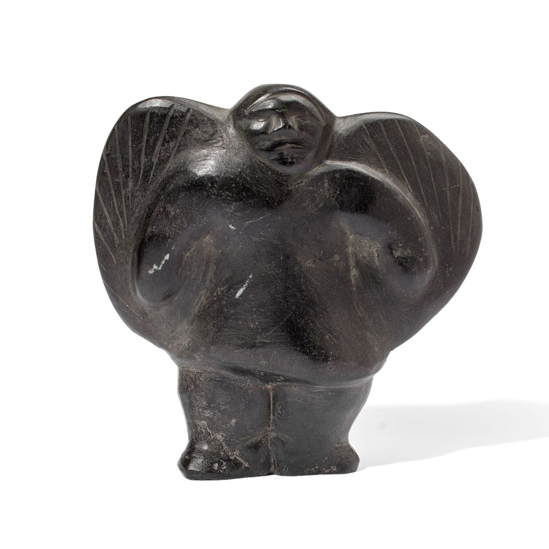 Barnabus Arnasungaaq Bird Shapeshifter Sculpure: Inuit dark stone sculpture of a shapeshifting shaman transforming into a bird, carved by Barnabus Arnasungaaq (1924 - 2017, Baker Lake). Signed in syllabics at base. Some surface nicks to stone; in ve