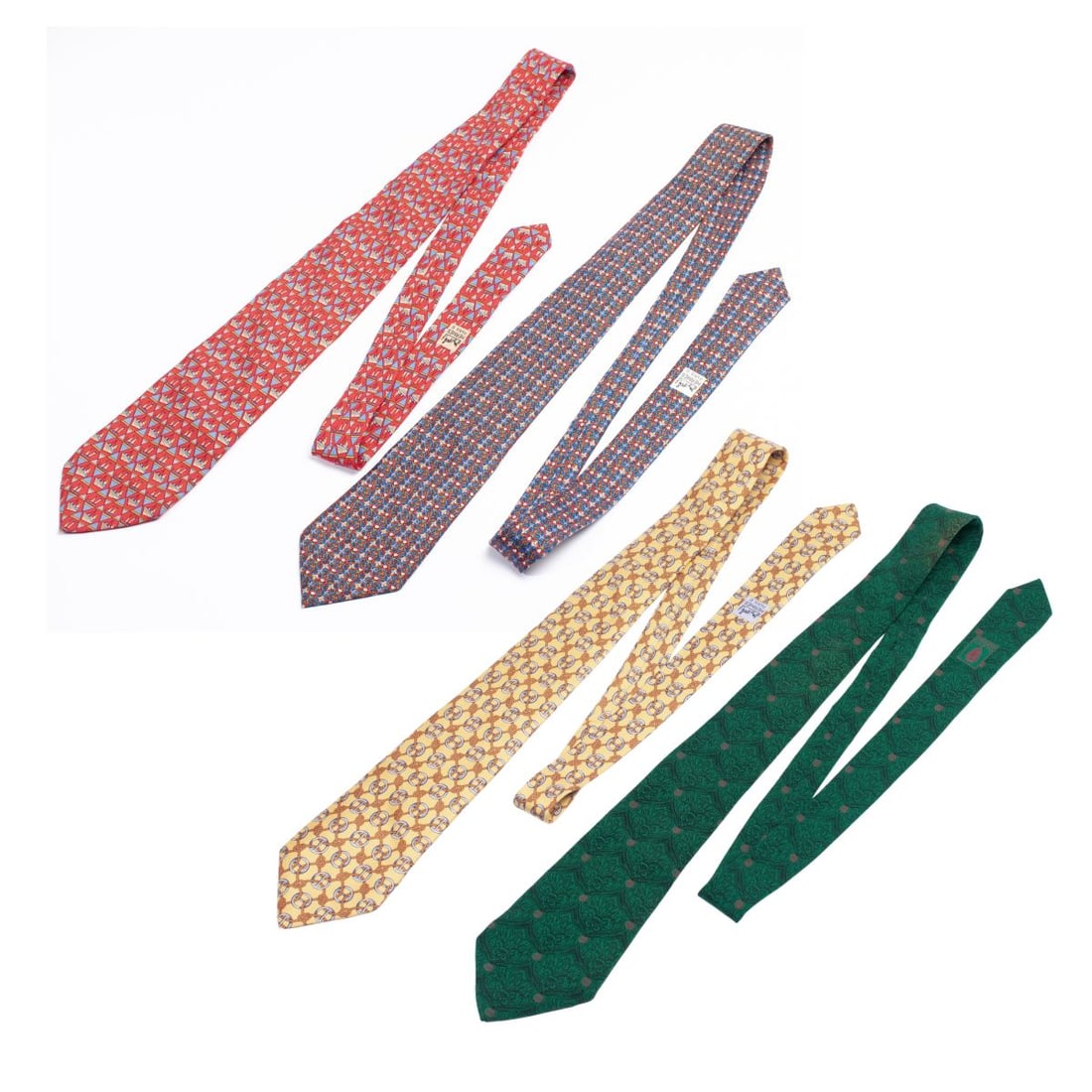 Gucci & Hermes Italy / France Men's Silk Ties: Group od four Gucci & Hermes ties. (1): Gucci Italy emerald color tie with ornate fleur-de-lis in black over emerald between interspersed Gucci logo in red. 100% silk. Made in Italy. With brand and ca