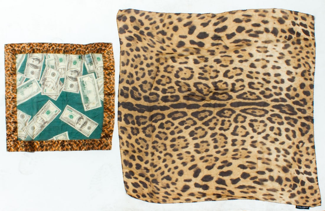 Dolce & Gabbana Silk Scarves: (1) Sheer silk leopard print scarf with original label. Hand rolled and stitched edges. 34.5" x 34.5" approx. (2) Sheer silk US money print square / scarf with leopard print borders. Original 