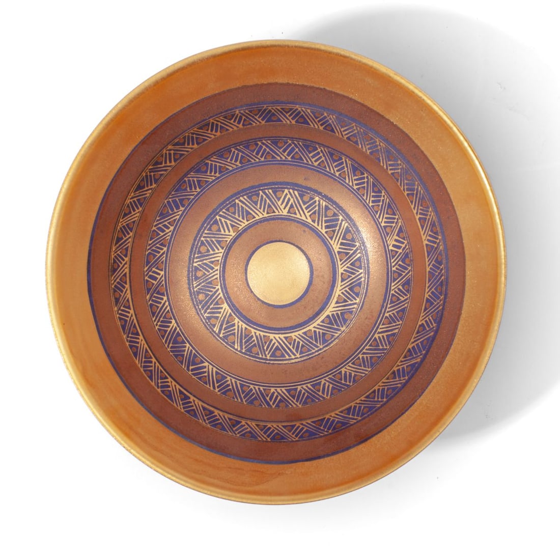 Mary Rich Studio Pottery Bowl: Mary Rich (1940 - 2022 United Kingdom) studio pottery bowl of flared conical form on tall foot with bands of alternating bands of luster glaze and chevrons in gilt over navy ground. Impressed 