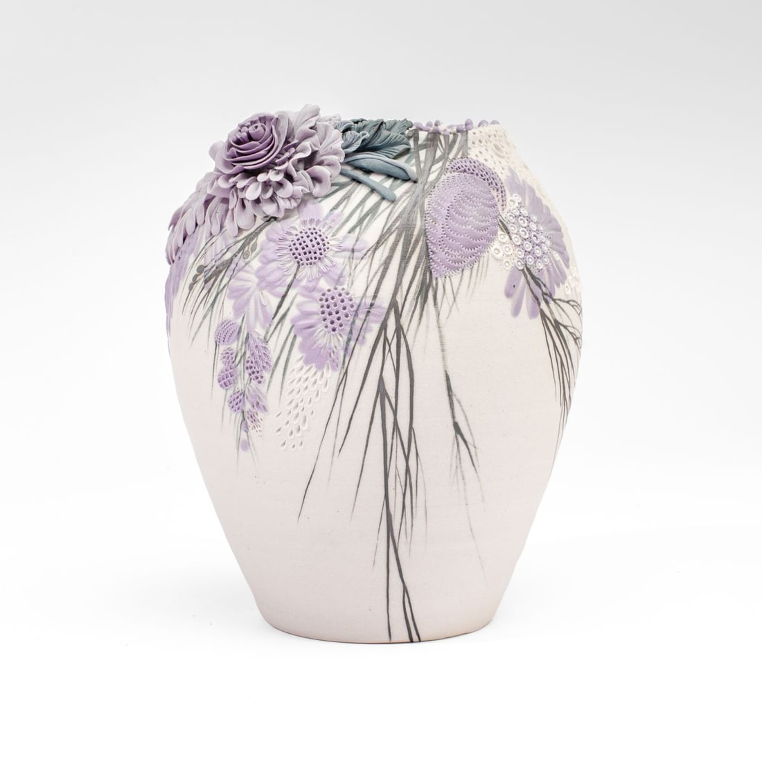 Galina Rein Pate-Sur-Pate Floral Vase: Hand-thrown vase in white paste with lilacs in pate-sur-pate technique by Galina Rein, with incised floral patterns to reverse; glaze-signed at base. In very good condition. 7" H.