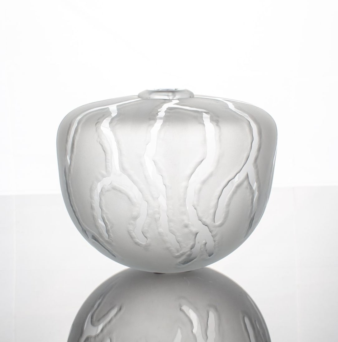 William Worcester Frosted Art Glass Vase: Glass vase of ovoid form and flat shoulder leading to narrow mouth in carved and frosted clear glass with polished drip pattern. By William Worcester (Hawaii). Signed at base and dated 1983. In very g