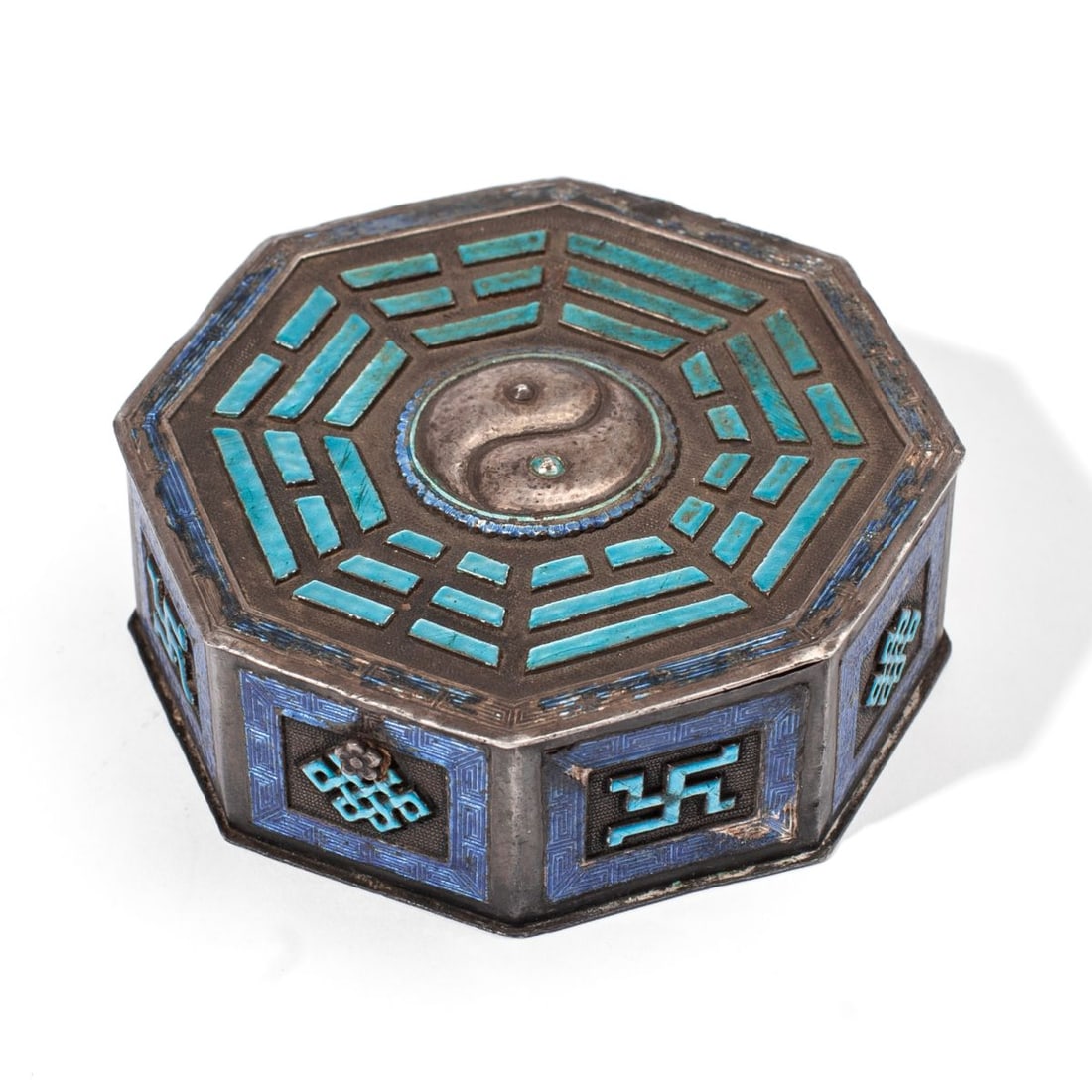 Antique Chinese Enameled Silver "Taijitu" Box: Old Chinese enameled silver box of octagonal form; the lid with central raised yin-yang taijitu symbol at center with the Eight Trigrams encircling, heightened in turquoise enamel; the body with repea