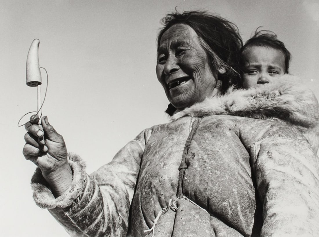 Richard Harrington Mother & Child Photograph: Richard Harrington (1911 - 2005 Canada) vintage silver gelatin photograph print, titled "Spence Bay, NWT, 1951". Signature and stamp. The Issacs/Inuit Gallery label to reverse. In stained oak wood fra