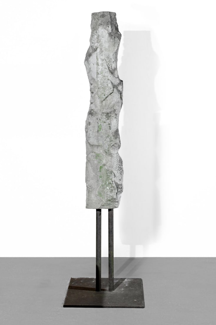 Tall Stone Sculpture by Ingo Hessel: Tall carved stone sculpture on iron stand by Canadian art historian Ingo Hessel, as per consignor. Which break to bottom (piece included). Some rust and weathering to stone. Sculpture 66.5" H x 9" acr