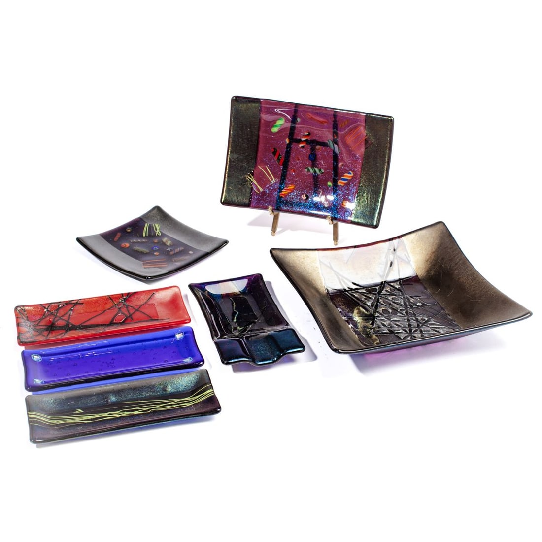 Kurt McVay (WA) Dichroic Iridescent Fused Glass: Collection of signed Kurt McVay dichroic iridescent fused art glass pieces. (1) Large square bowl.2" H x 9.5" x 9.5". (2) Rectangle plate. 9" x 6". (3) Square plate. 6" x 6". (4) Cigar ashtray. 7.25"