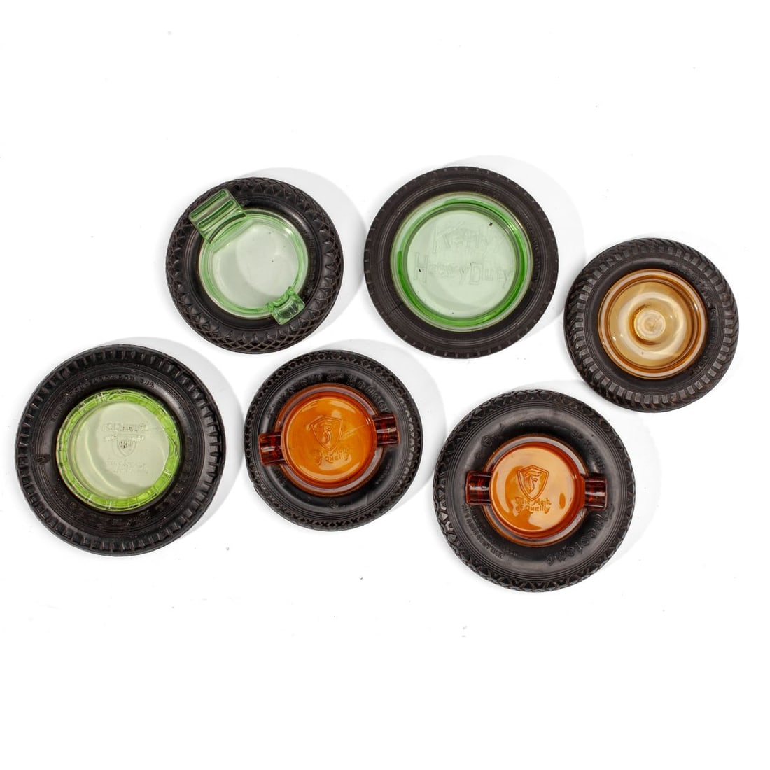 Vintage Rubber Tire Advertising Ashtrays: Collection of 6 vintage advertising rubber tire and glass insert ashtrays. (1) Allstate Balloon with axel / lug nut form amber insert. Slight age warping. 5.5". (2) Firestone 32 x 6 H.D. with amber in