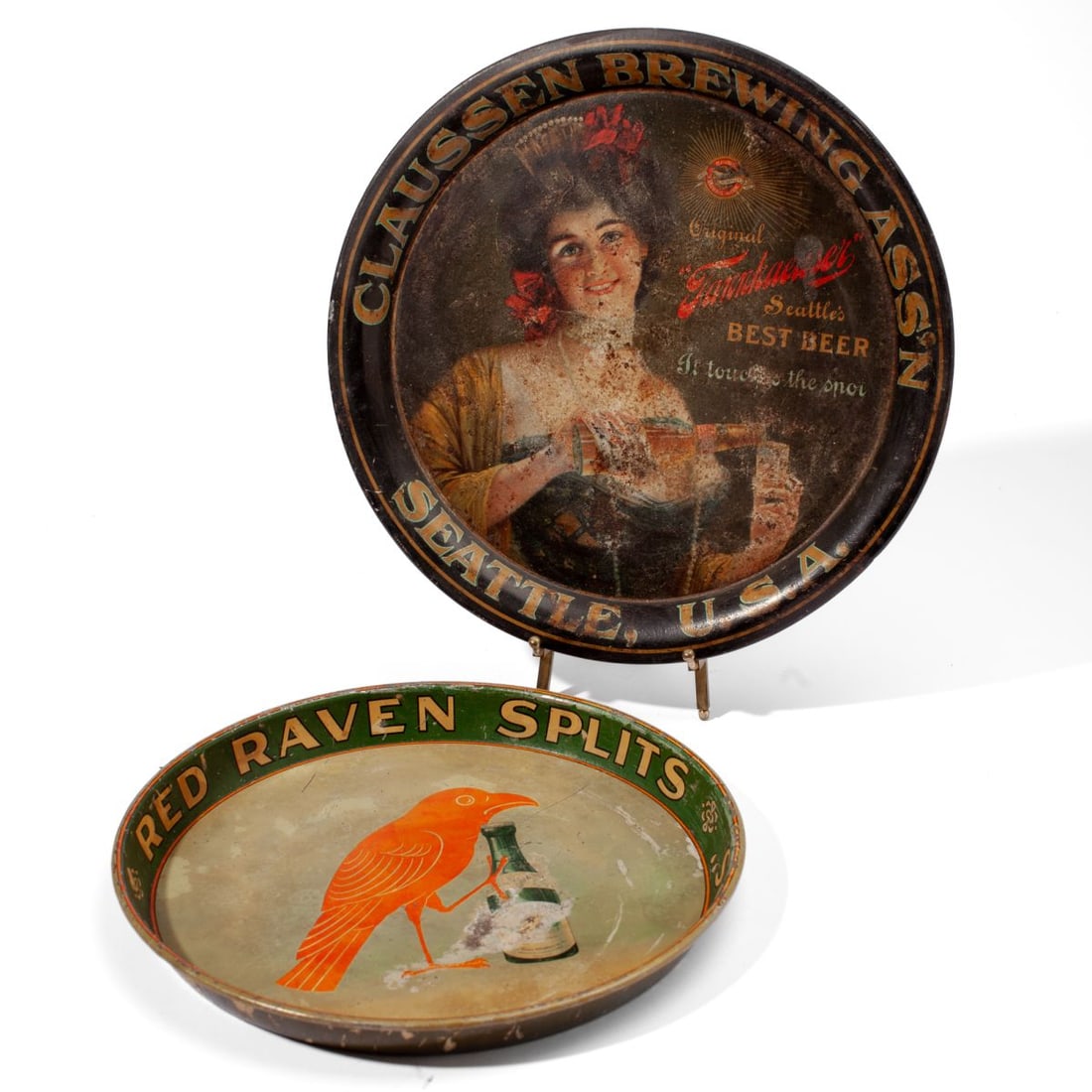 Claussen Brewing Seattle & Red Raven Splits Trays: Claussen Brewing Association and Red Raven Splits beer tip trays. Claussen features original Tannhaeuser, "Seattle's Best Beer". Surface wear; pitting, losses to image and foam residue to reverse of e