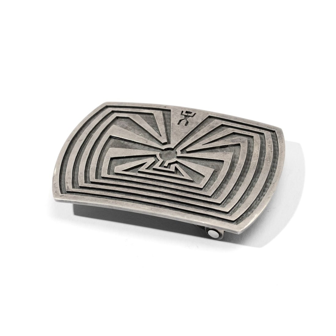 Mark Tawahonva Man in the Maze Silver Belt Buckle: Mark Tawahonva (b. 1948 Hopi) silver belt buckle with "man in the maze" in deep relief. Artist's hallmark to reverse. Exact silver content unknown but probably sterling. In very good condition with li
