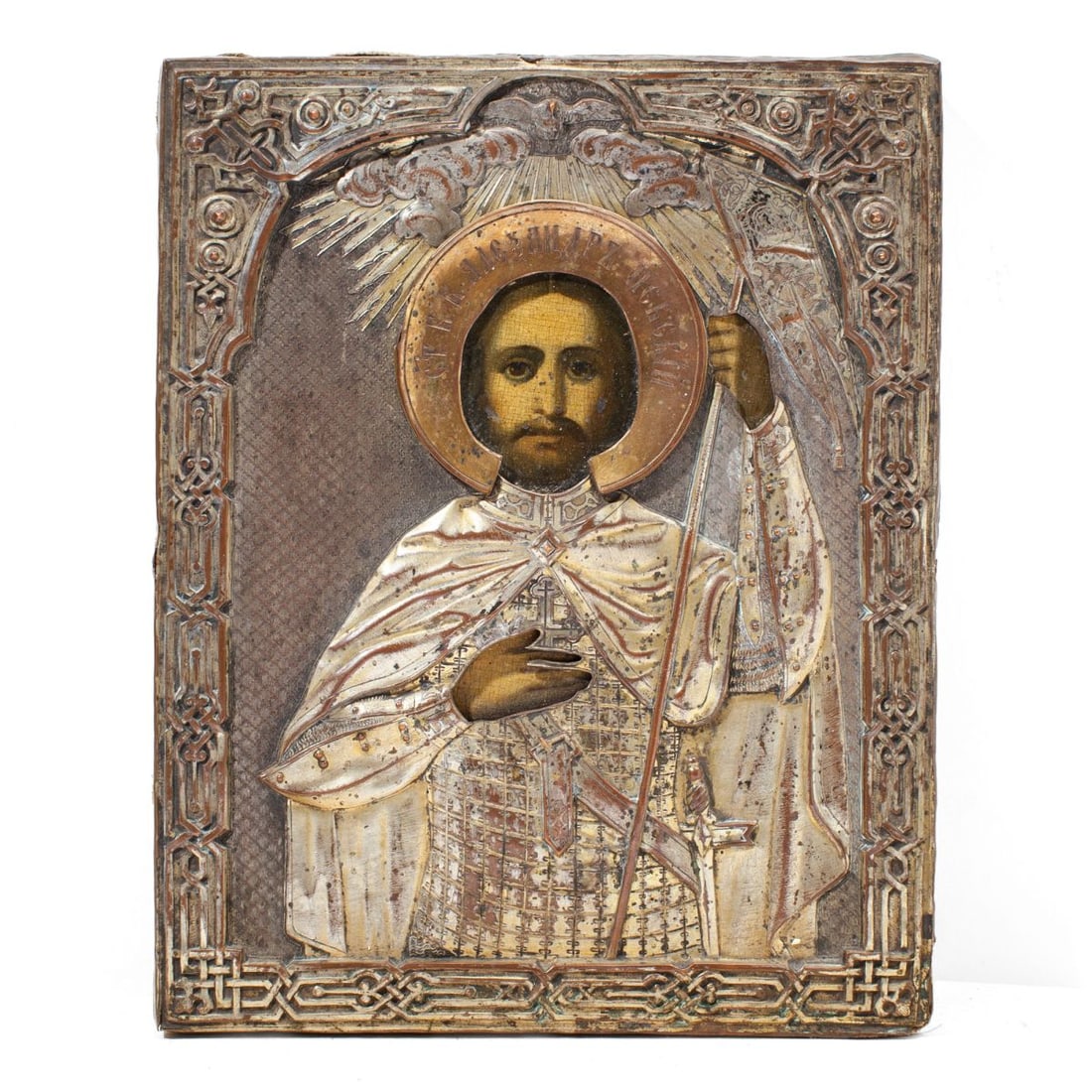 Russian Gilt Copper Icon of St. Alexander Nevsky: Antique Russian icon depicting St. Alexander Nevsky in oil pigments on panel underneath hammered and chased gilt-copper oklad / riza and velvet lining to underside. 19th century. Craquelure; some grim
