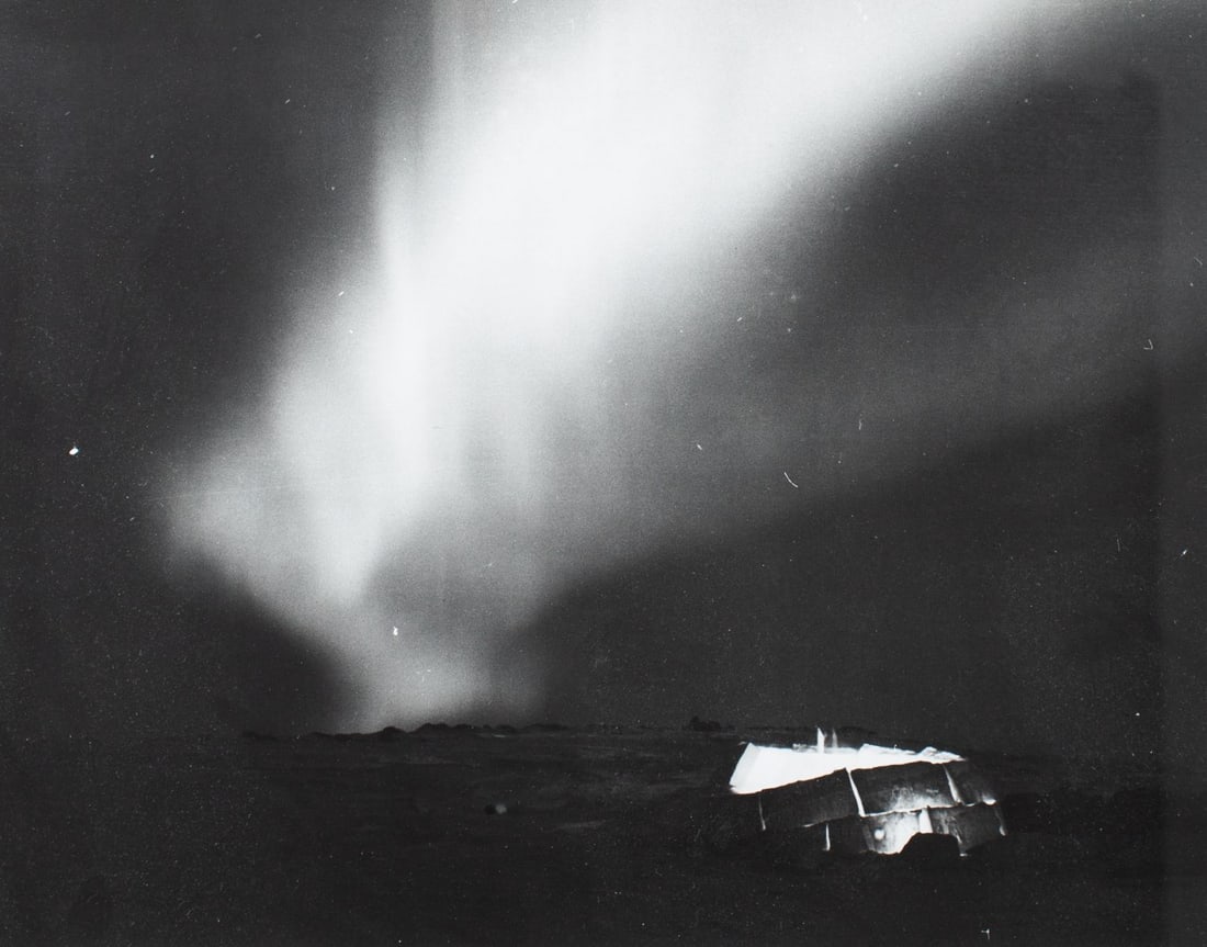 Richard Harrington Northern Lights Photograph: Richard Harrington (1911 - 2005 Canada) vintage silver gelatin photograph print of Northern Lights and igloo. On back reads "An igloo is being built as northern lights weave above. Canadian Arctic 195