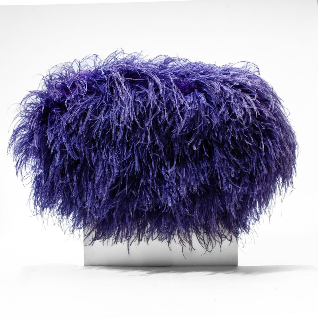 Mary Ehrin (CO) Mixed Media Wall Sculpture: "Study for-----Purple Python Pool (2000)", 2000. Oval wood plaque covered with purple dyed osterich feathers. Signed to the reverse in purple paint: EHRIN MC3699 along with title and date in pencil. 1