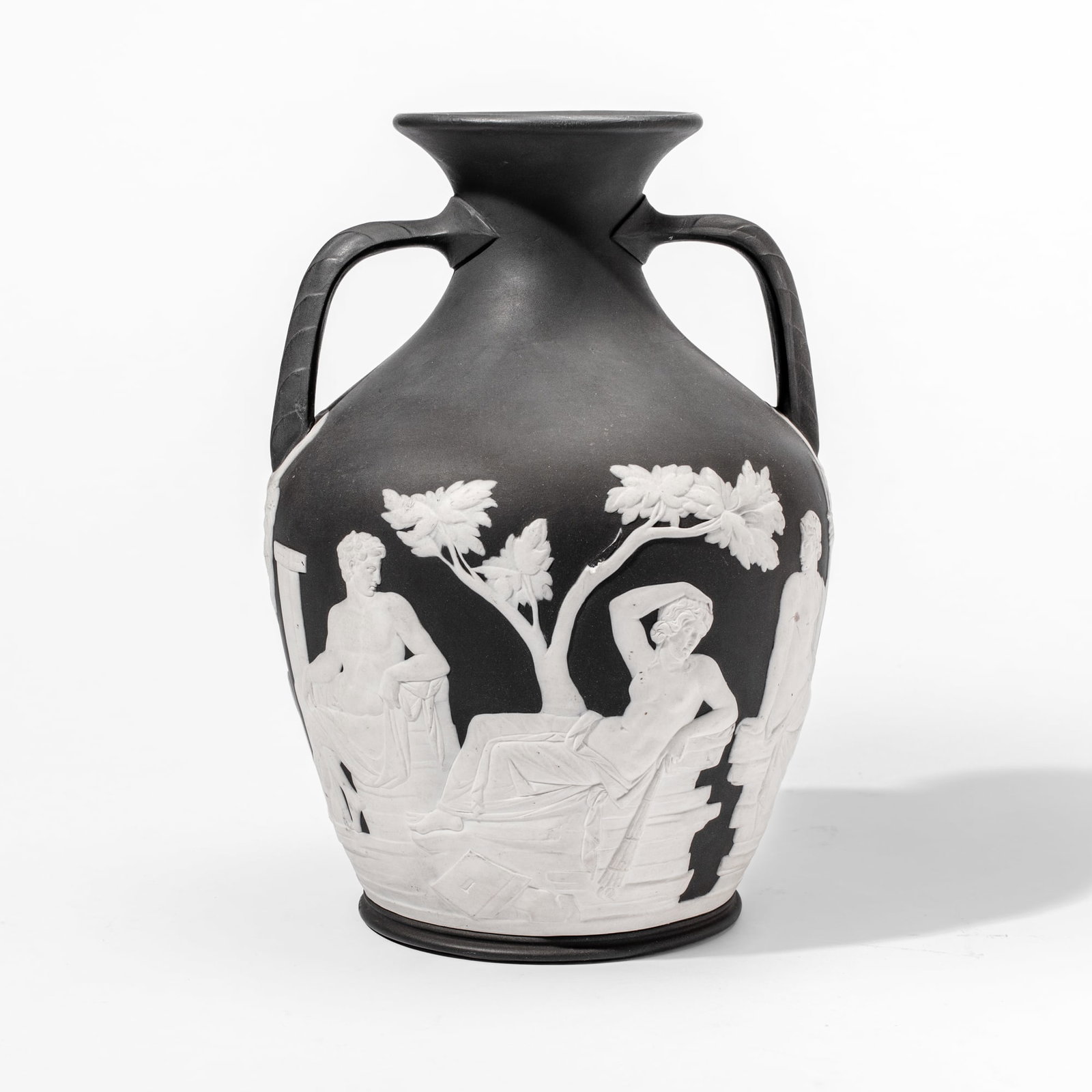 Wedgwood Black Basalt Portland Vase: Early 19th century Wedgwood black basalt Portland Vase. Impressed "WEDGWOOD" mark at base and impressed "T. L" at sprigging above; the underside with portrait of a man in a Phrygian cap. Loss to sprig