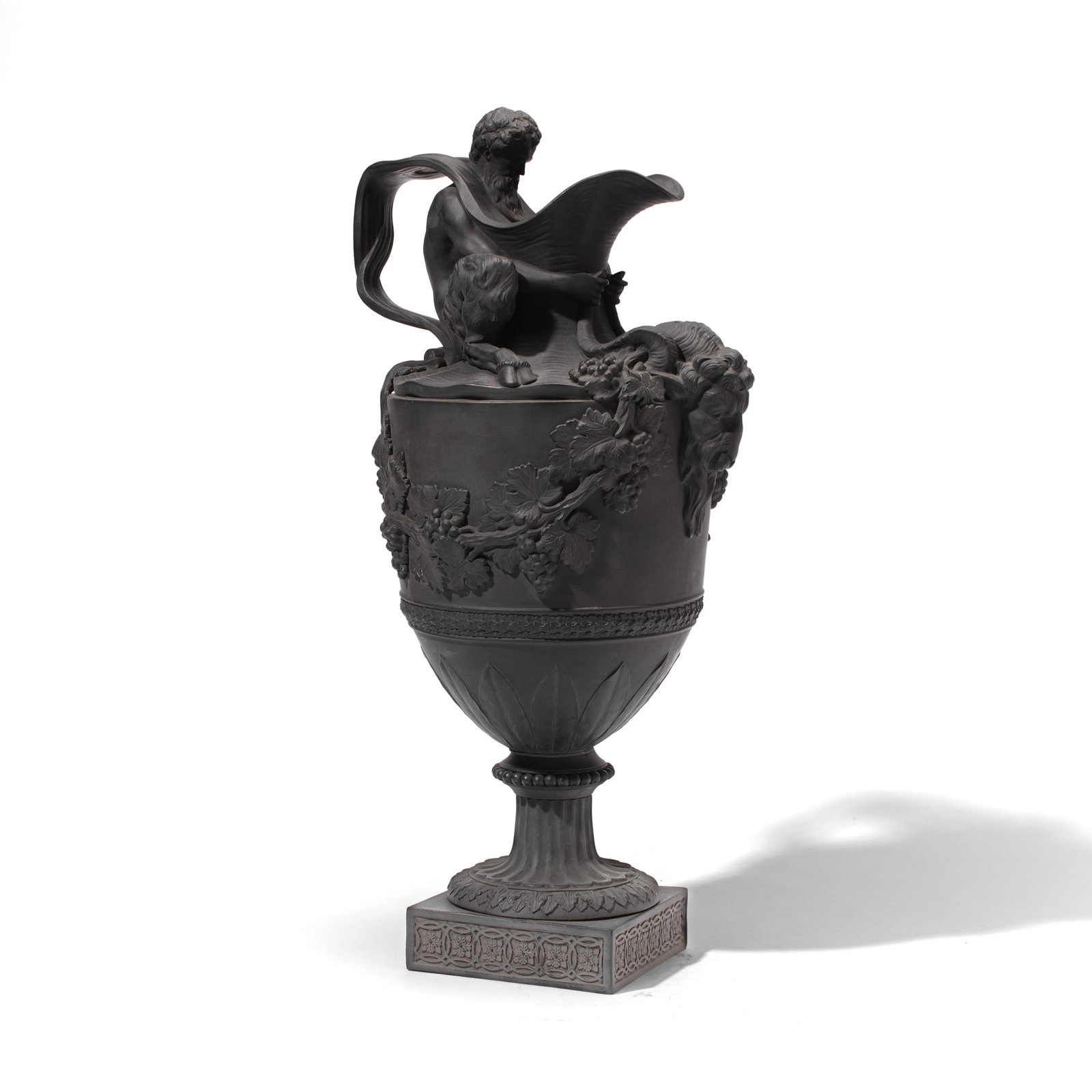 Wedgwood "Sacred to Bacchus" Black Basalt Ewer: 19th century Wedgwood "Sacred to Bacchus" black basalt water ewer. Depicting Bacchus gripping the horns of a ram with grapevines extending from horns above band of acanthus and leaves leading to flute