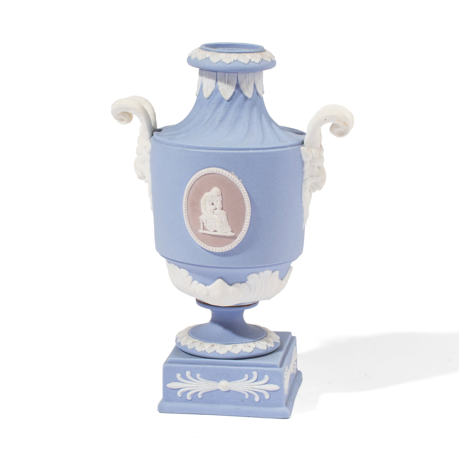 Wedgwood Tricolor Jasperware Urn: 19th century Wedgwood tricolor jasperware urn on circular socle and plinth base. In blue, white, and lilac dip, the body having cameos depicting classical figures between goat head handles. Impressed 