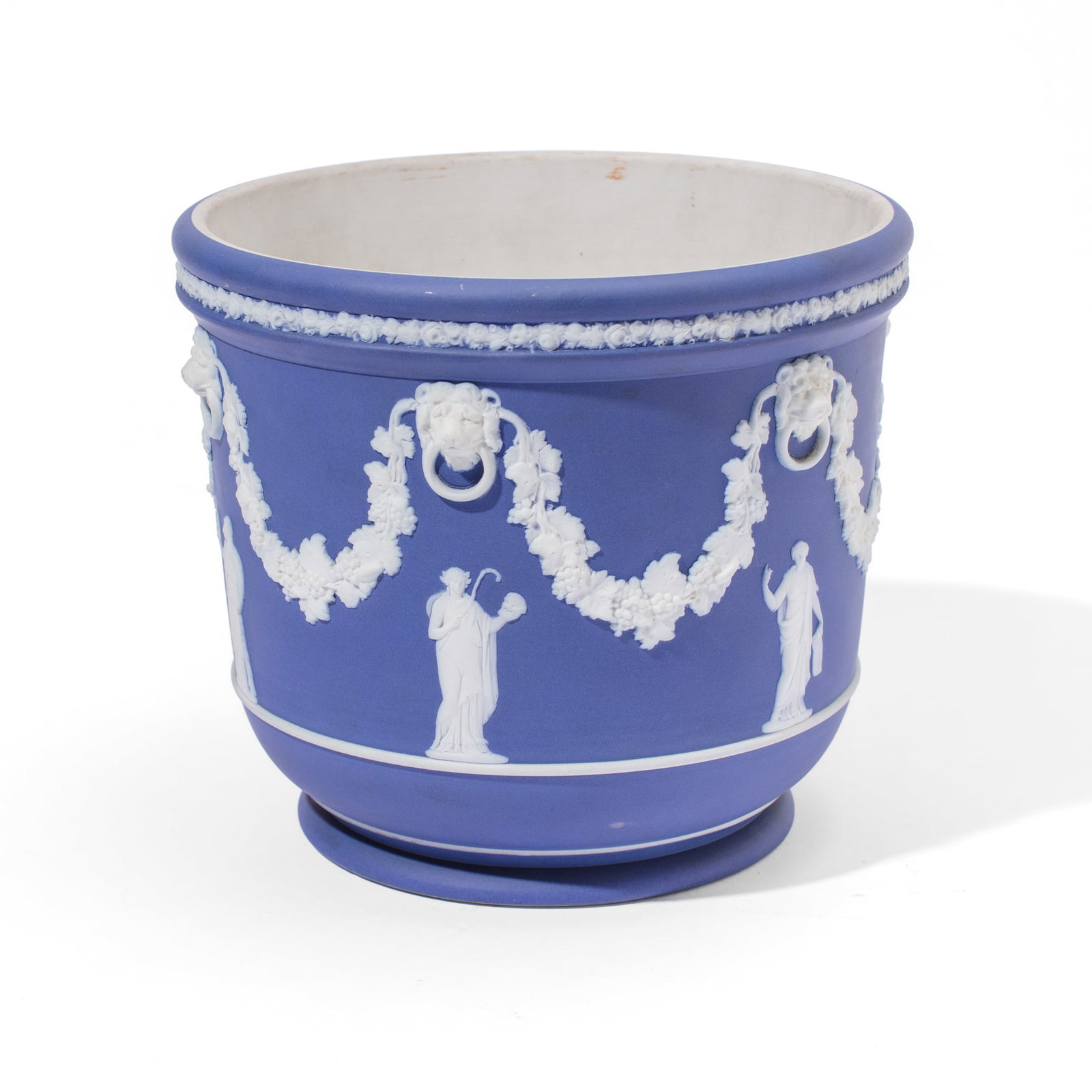 Wedgwood Blue Jasperware "Muses" Cachepot: Late 19th century / early 20th century Wedgwood blue jasperware cachepot, the body having muses below hanging grape garlands between lion heads all below floral border. Impressed "WEDGWOOD" and "ENGLA