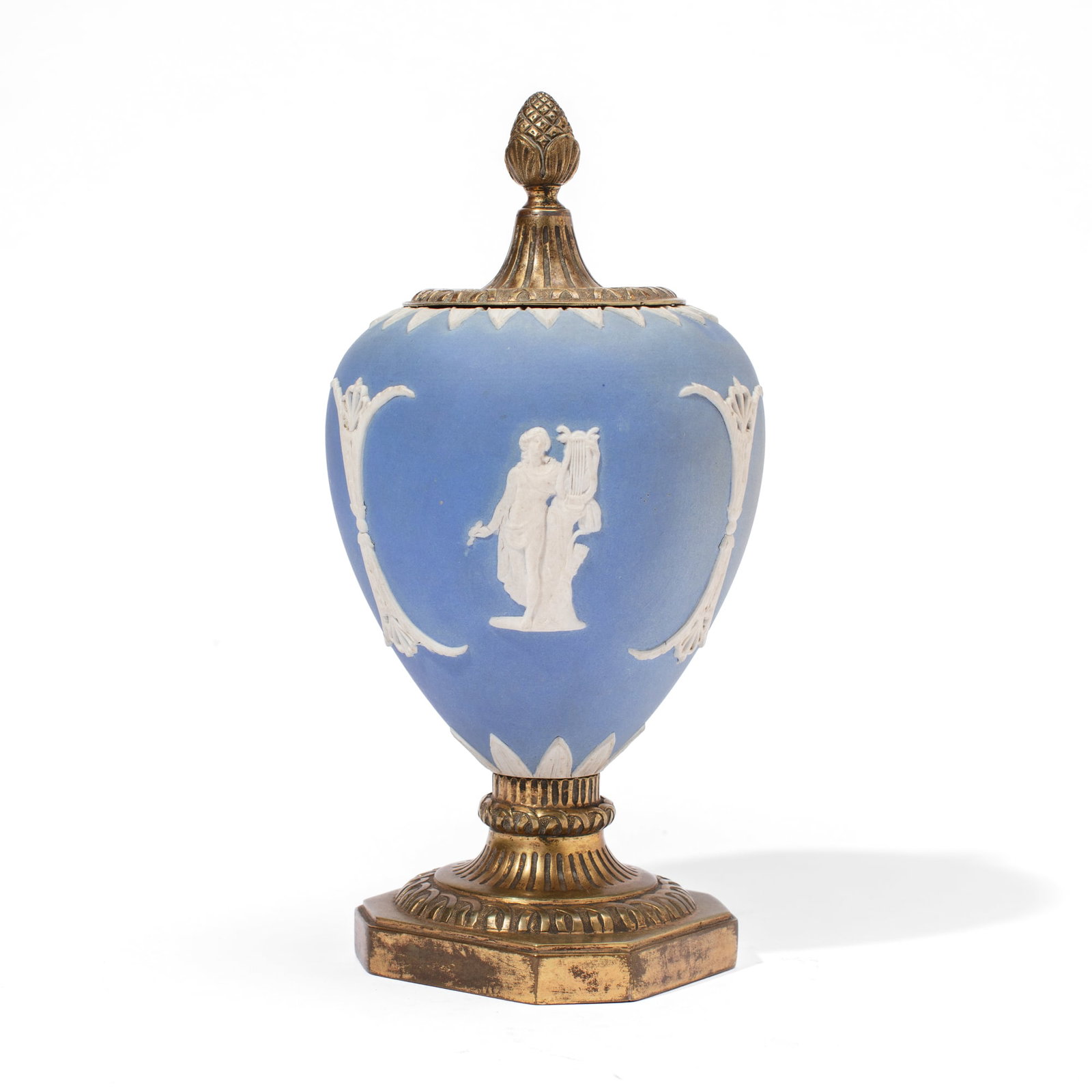 Wedgwood Bronze-Mounted Blue Jasperware Vase: 19th century Wedgwood blue jasperware vase of ovoid form with muses, having bronze acorn cover and circle socle and plinth base. Wear and patination to bronze; some areas of discoloration to dip but i