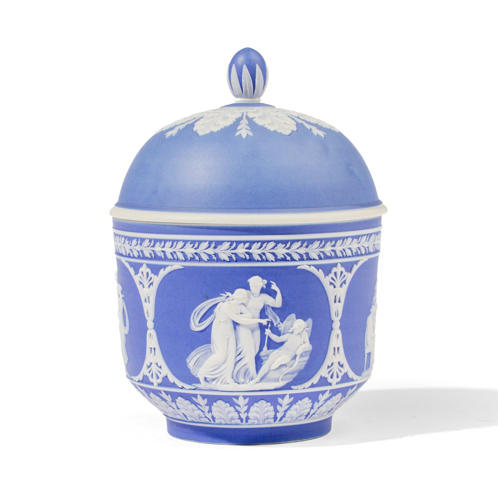 Wedgwood Blue Jasperware Tobacco Jar: 19th century Wedgwood blue jasperware lidded tobacco jar, the body having figural scenes including the Three Graces between laurel and anathus bands, the domed lid with radiating acanthus spray. Impre