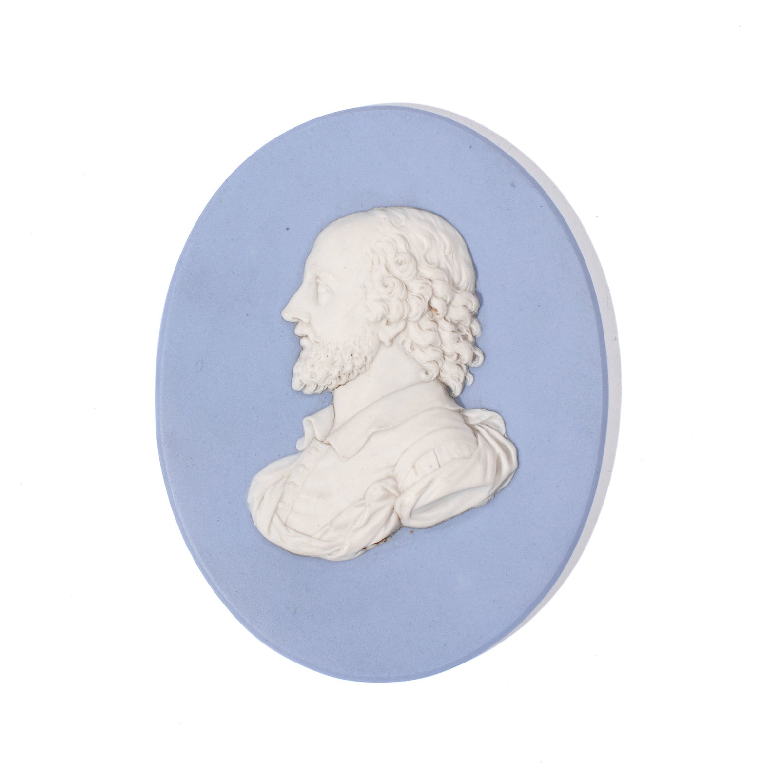 Wedgwood Blue Portrait Medallion of Shakespeare: Late 18th century Wedgwood jasperware portrait medallion of Shakespeare facing left in white over solid blue. Impressed "WEDGWOOD" mark to reverse with penciled title and accession number. Slight firi