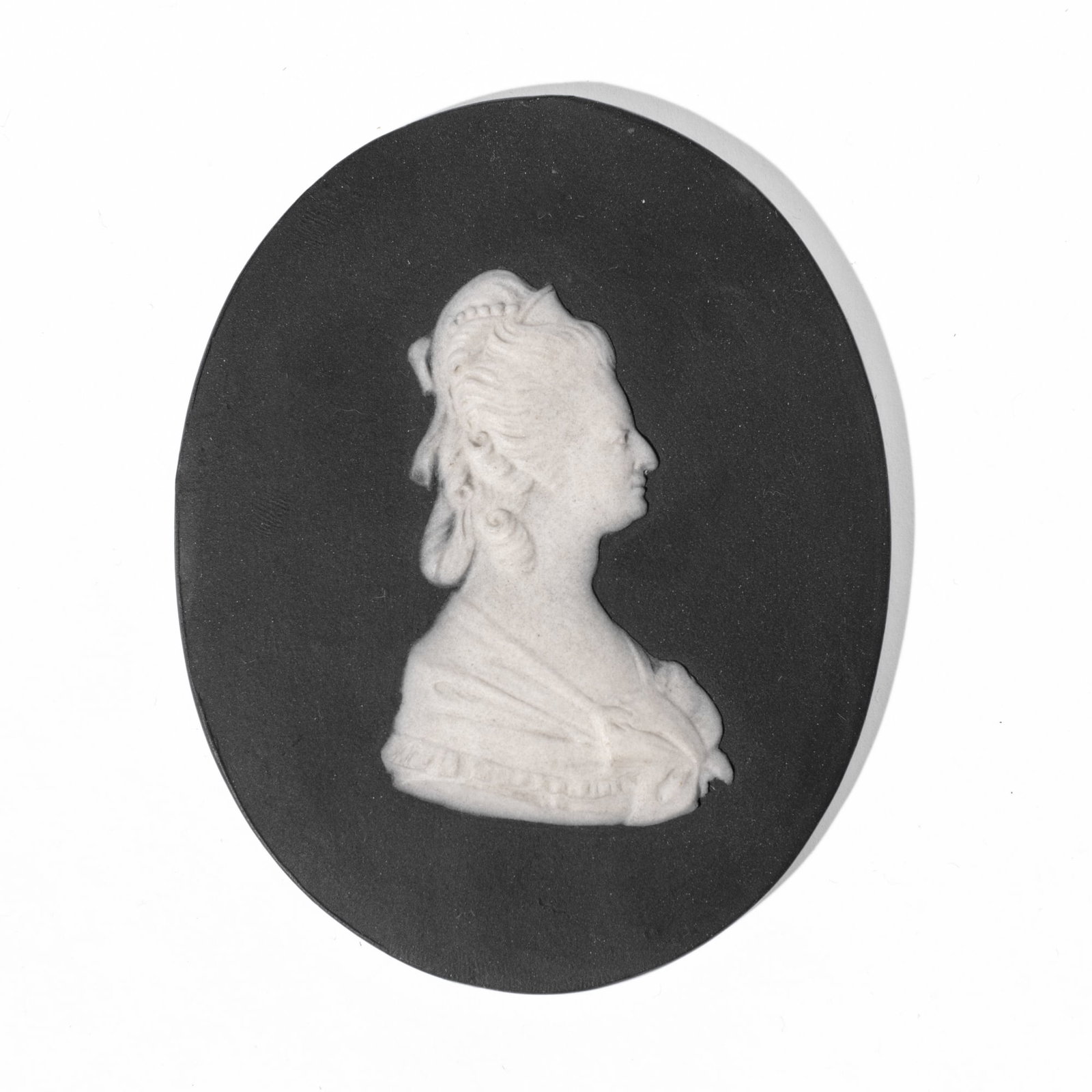 Wedgwood Portrait Medallion of Marie Antoinette: Late 18th century Wedgwood black basalt dip portrait medallion of Marie Antoinette. Impressed "WEDGWOOD" mark and accession number to reverse. Chip to reverse; otherwise in good condition. 3.5x3".