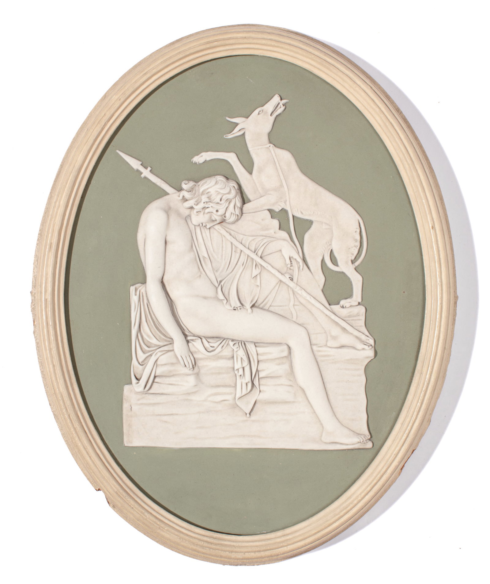 Wedgwood Green Jasperware Plaque of Endymion: Early 19th century Wedgwood plaque depicting Endymion with his dog in white against solid sage green. In painted wood frame. Impressed "WEDGWOOD" mark to reverse. Small loss to frame at lower edge; th