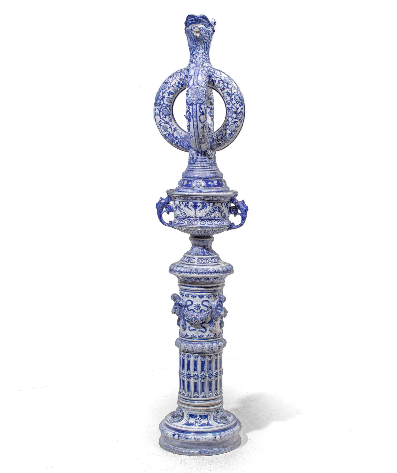 Trio of Antique German Salt Glazed Large Items: Trio of German Westerwald Salt Glazed Large Pottery Items, circa 19th century. Gray glaze molded with raised cobalt decoration. Includes (1) Monumental Ewer with eagle-form neck, body of two intersect
