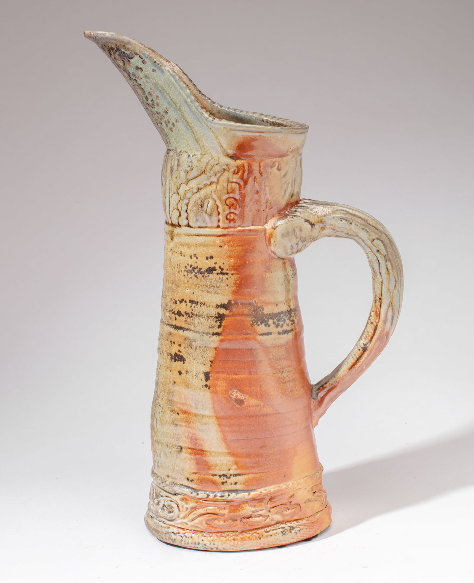 Gina Freuen (WA) Large "Rococo Pitcher": Gina Freuen (Washington) Large Wood Fired Stoneware "Rococo Pitcher", 2008. Signed on base; exhibition label affixed. Measures 20x12x6". Collection of Mike Peck, Seattle WA. Excellent condition.