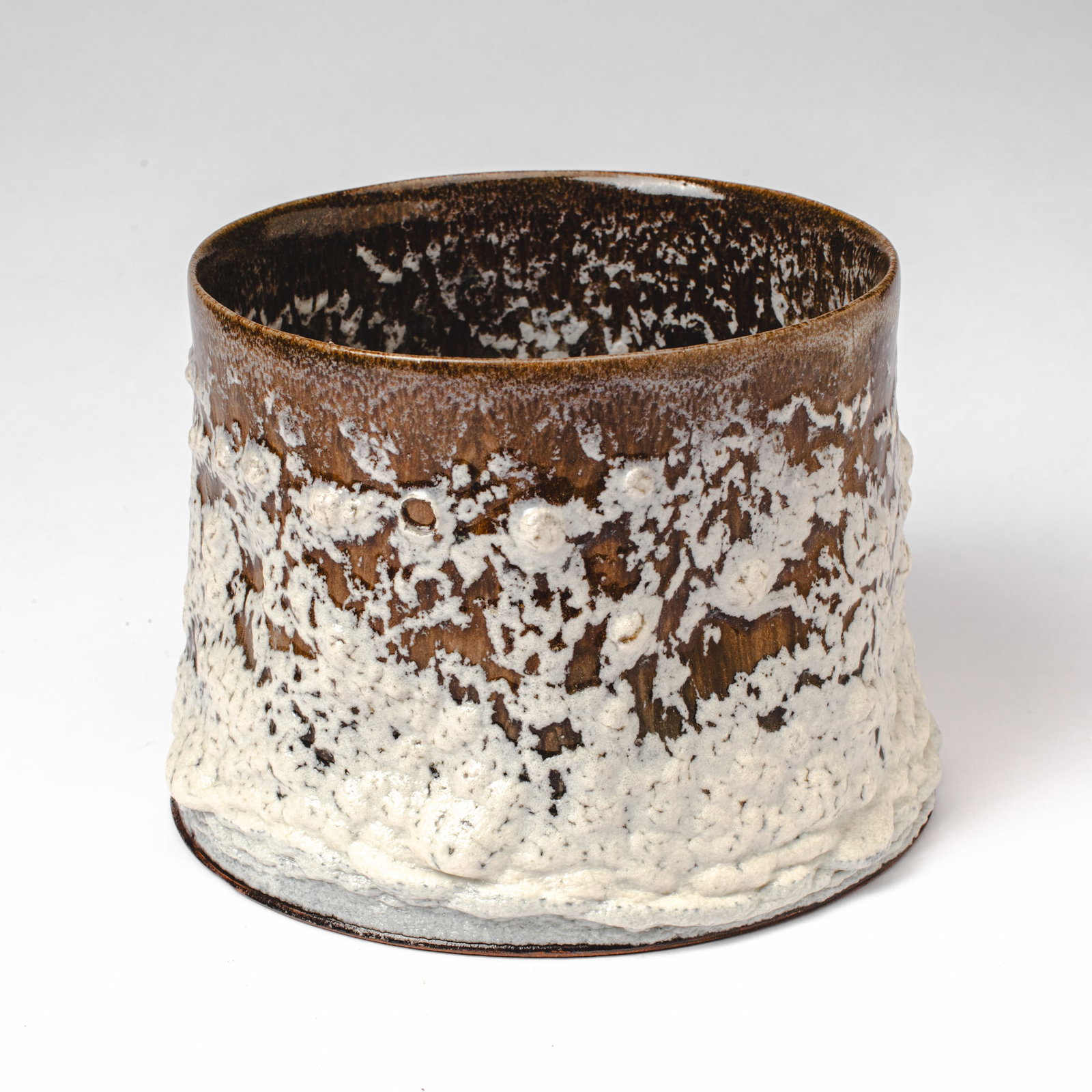 Jussi Ojala Ash Glaze White Stump Pot: Jussi Ojala (b. 1956 Sweden) Ash Glaze White Stump Pot. Signed on base. Acquired in 2008 in Brussels from Puls Ceramics Gallery. Measures 7.5x10". Collection of Mike Peck, Seattle WA. Chip to glaze bu
