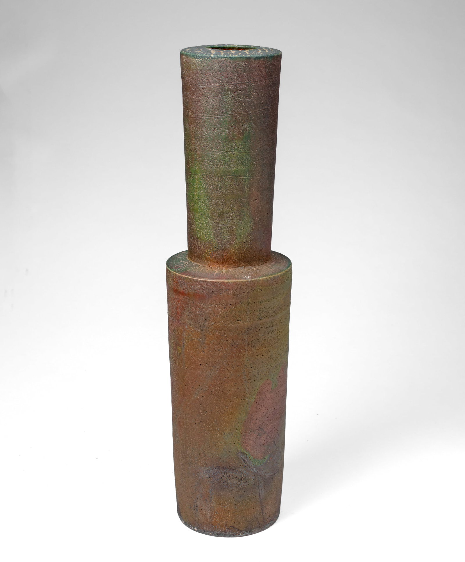 Brian O'Neill (WA) Raku Fired Tall Vase: Brian O'Neill (Washington) Raku Fired Tall Vase. Unsigned. Stoneware vase with green, red, and copper sheen glaze. Measures 25.5x7". Collection of Mike Peck, Seattle WA. Excellent condition.