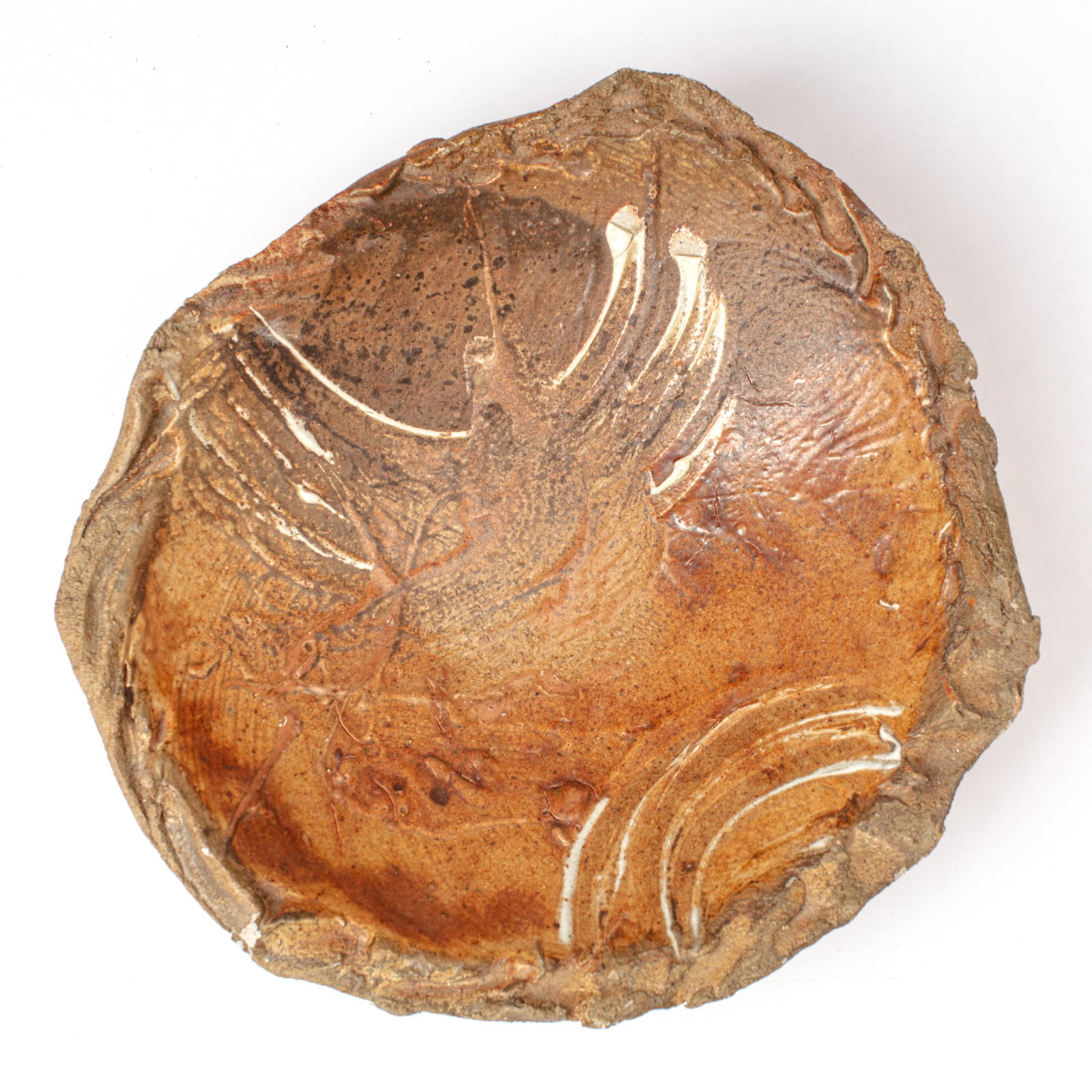 Don Reitz Brutalist Stoneware Charger: Don Reitz (1929-2014 Arizona) Brutalist Stoneware Charger. Signed on back. Thick shallow bowl form with rough edges and embossed decorations, expressive glaze splashes. Measures 15x4". Collection of