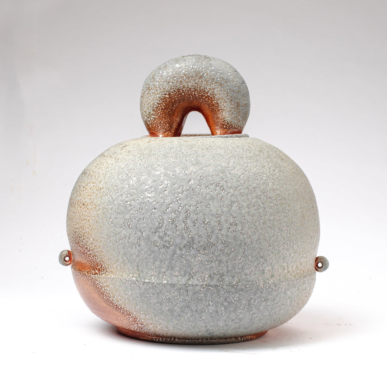 Adam Helenske (WA) Stoneware Lidded Pot: Adam Helenske (Washington) Wood Fired Stoneware Lidded Pot. Signed on base. Large ball shaped pot with chunky bail style handle; ringlets at sides; heavy texture with a lovely metallic shine.