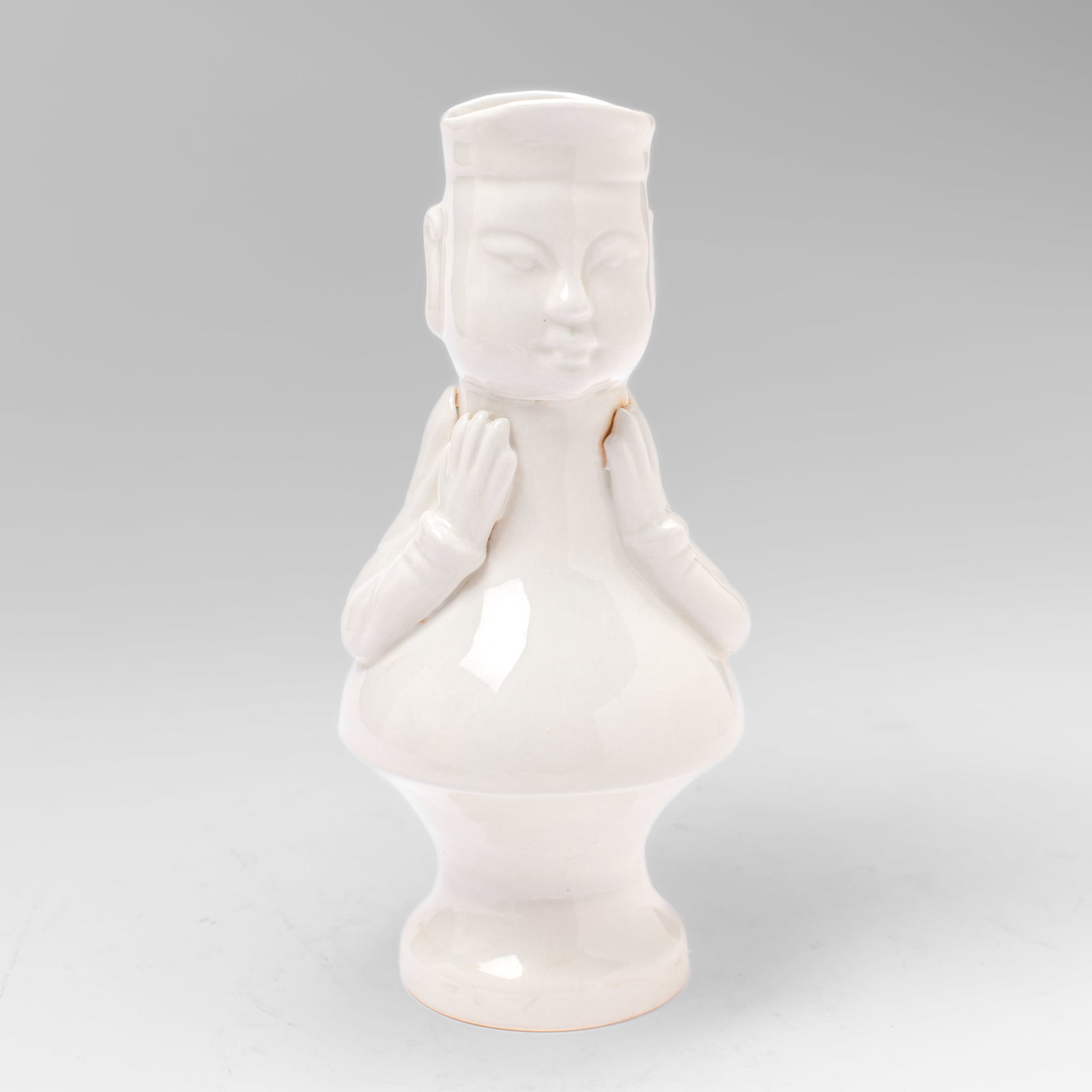 Chinese Export Dehua Porcelain "Mandarin" Ewer: Chinese export Dehua-type white-glazed porcelain ewer in the form of a Mandarin with molded and applique arms and hands. In very good condition. 9" H.