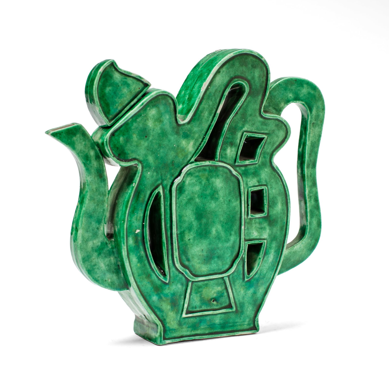 Chinese Apple Green Glaze "Fu Character" Teapot: Chinese teapot in the shape of the character "Fu", covered all-over with apple-green glaze. Kangxi period. Small chip to lid; some grit at surface. 7.5" H x 8" Across.