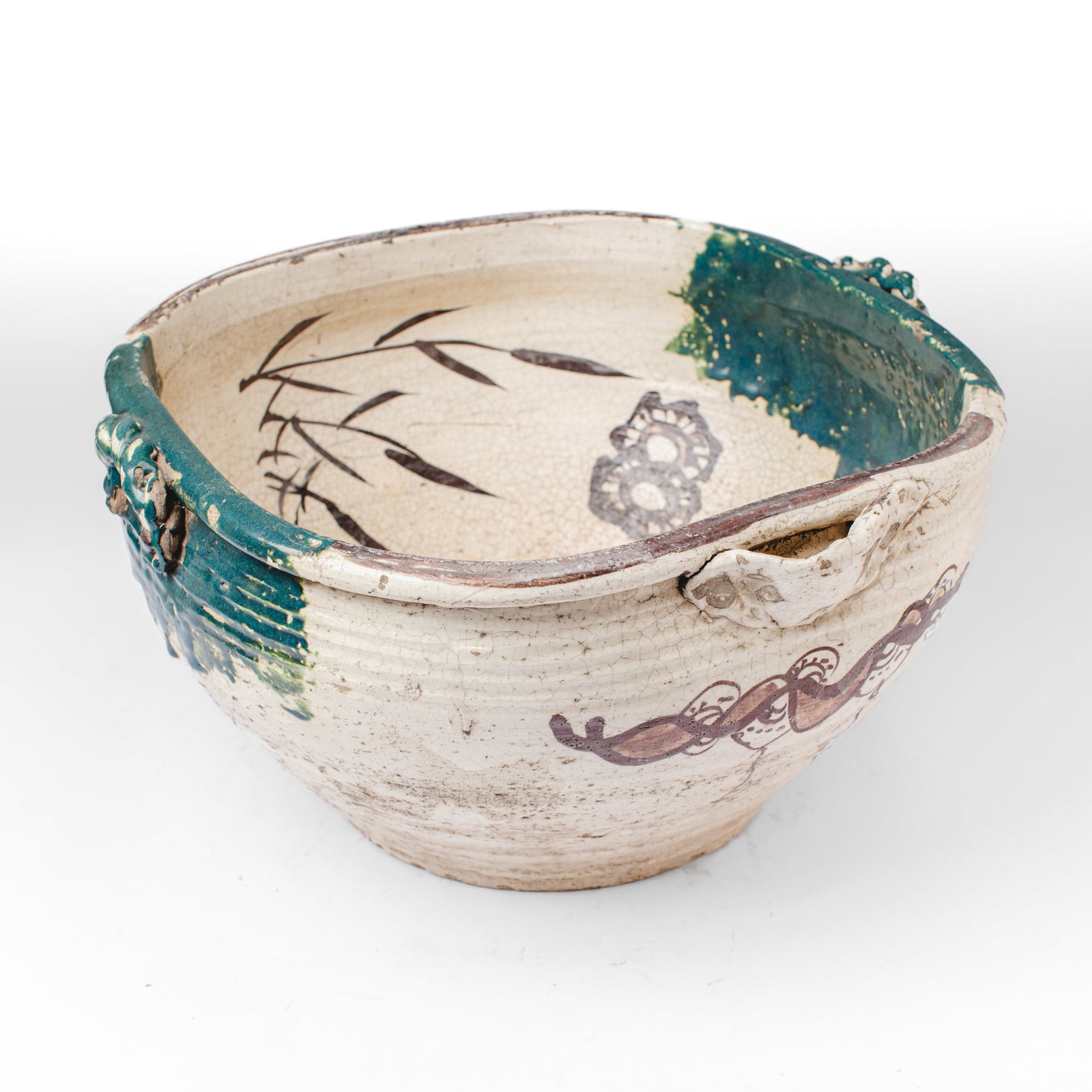 Large Antique Japanese Oribe Ware Basin: Large Antique Japanese Oribe Ware washbasin or tub having painted waves, sacred jewels, wheels and grass sprays in iron-brown glaze to interior over cream with splashes of green at handles, the exteri