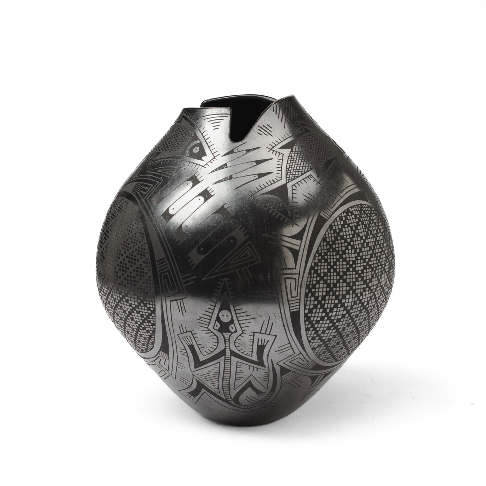 Mata Ortiz Blackware Pottery Jar By Eusebio Sando: Mata Ortiz blackware pottery jar by Eusebio Sandoval with fish and geckos between checkered roundels and geometricized motifs in burnished relief. Incised signature to underside. Three cracks to body 