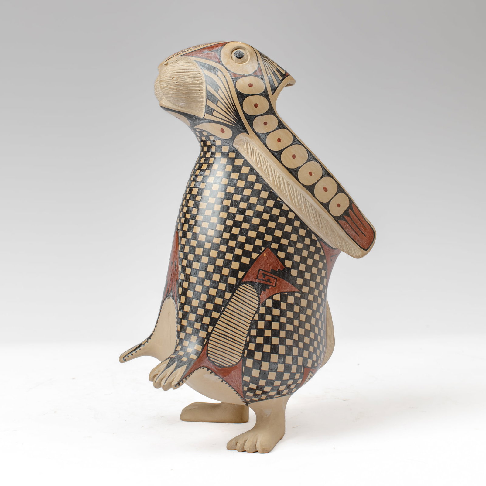 Mata Ortiz Pottery Rabbit by Nicolas Ortiz: Mata Ortiz pottery rabbit in beige clay with fine-line checkered and geometric patterns in pigments by Nicolas Ortiz (20th c. Casa Grande). Incised signature to bottom. Small chip to back of one ear,