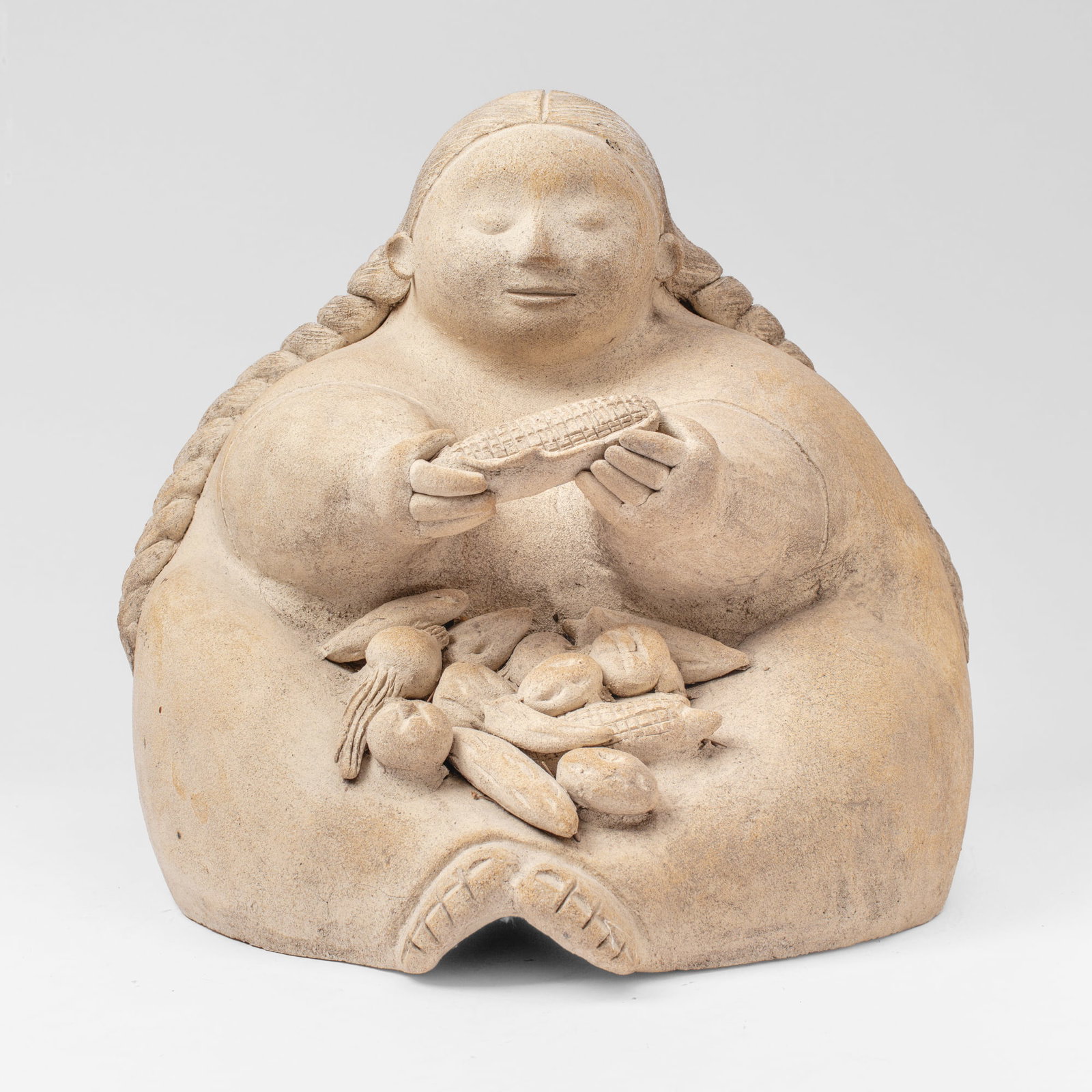 Stoneware "Gordita" Market Lady Sculpture: Stoneware "Gordita" Market Lady Sculpture. A sculpture in the style of San Juan de Limay; Unglazed hand built sculpture of a woman with lap full of vegetables. Made in Tacoma by visiting artists to