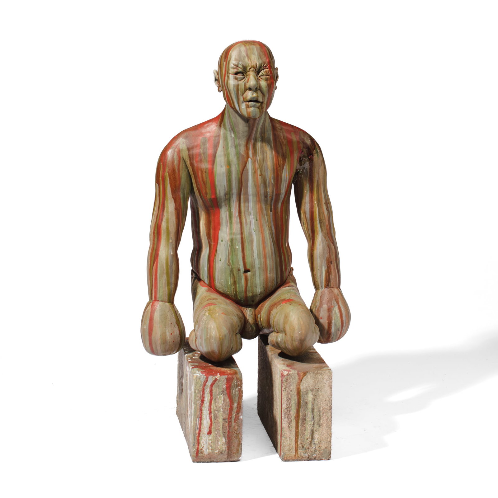 "The Boxer" Ceramic Sculpture: "The Boxer" Ceramic Sculpture. Unsigned. Glazed white ceramic depicting boxer or fighter in resting position with notable swollen eye. Sculpture sits atop 2 vintage A.P. Green Bricks that also have dr