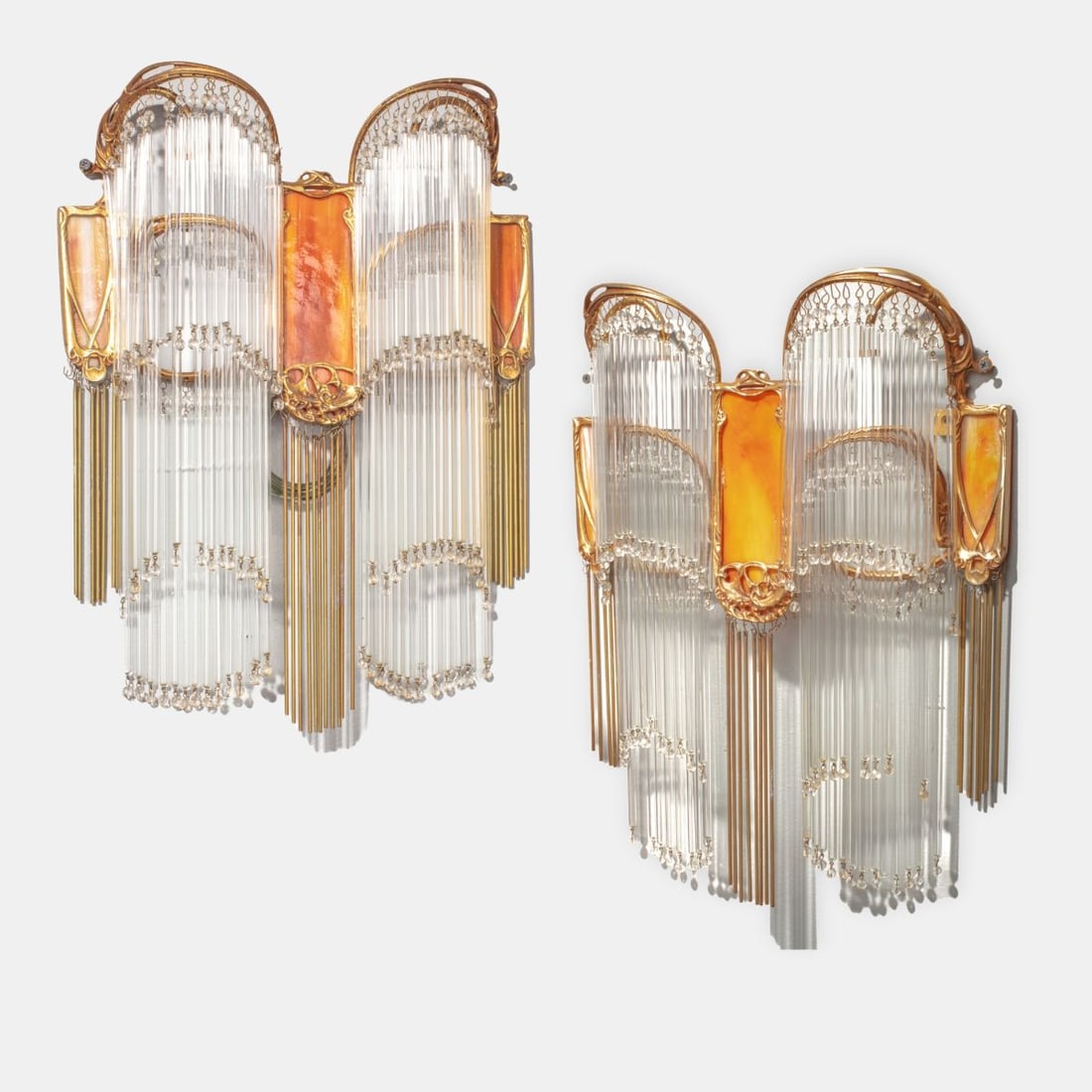 Pair Hector Guimard Art Nouveau Ormolu Sconces: Pair Hector Guimard Art Nouveau Ormolu Gilt Bronze Sconces. Amber colored stained slag glass medallions at center and sides. Glass tube prisms and brass rod drops. Unsigned; vintage Christie's sale ta