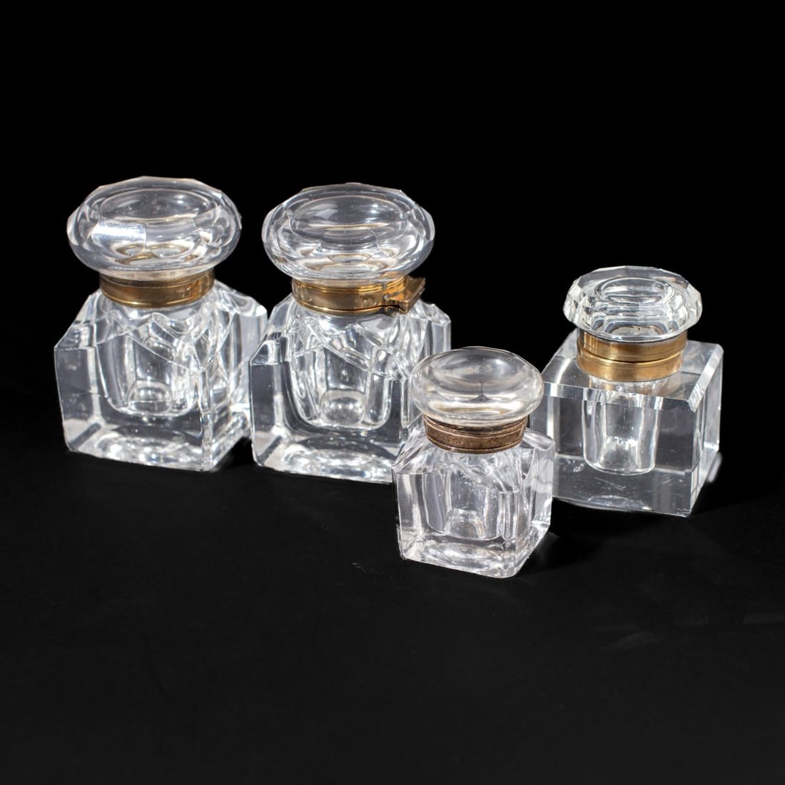 English Regency Glass Inkwells - Includes Pair: Group of 4 English Regency glass inkwells. (1) Pair large molded glass inkwells. Cut and polished lid with brass hinges. 4" H x 2.5" x 2.5". (2) Flat cut and polished glass inkwell. Brass hinged lid.