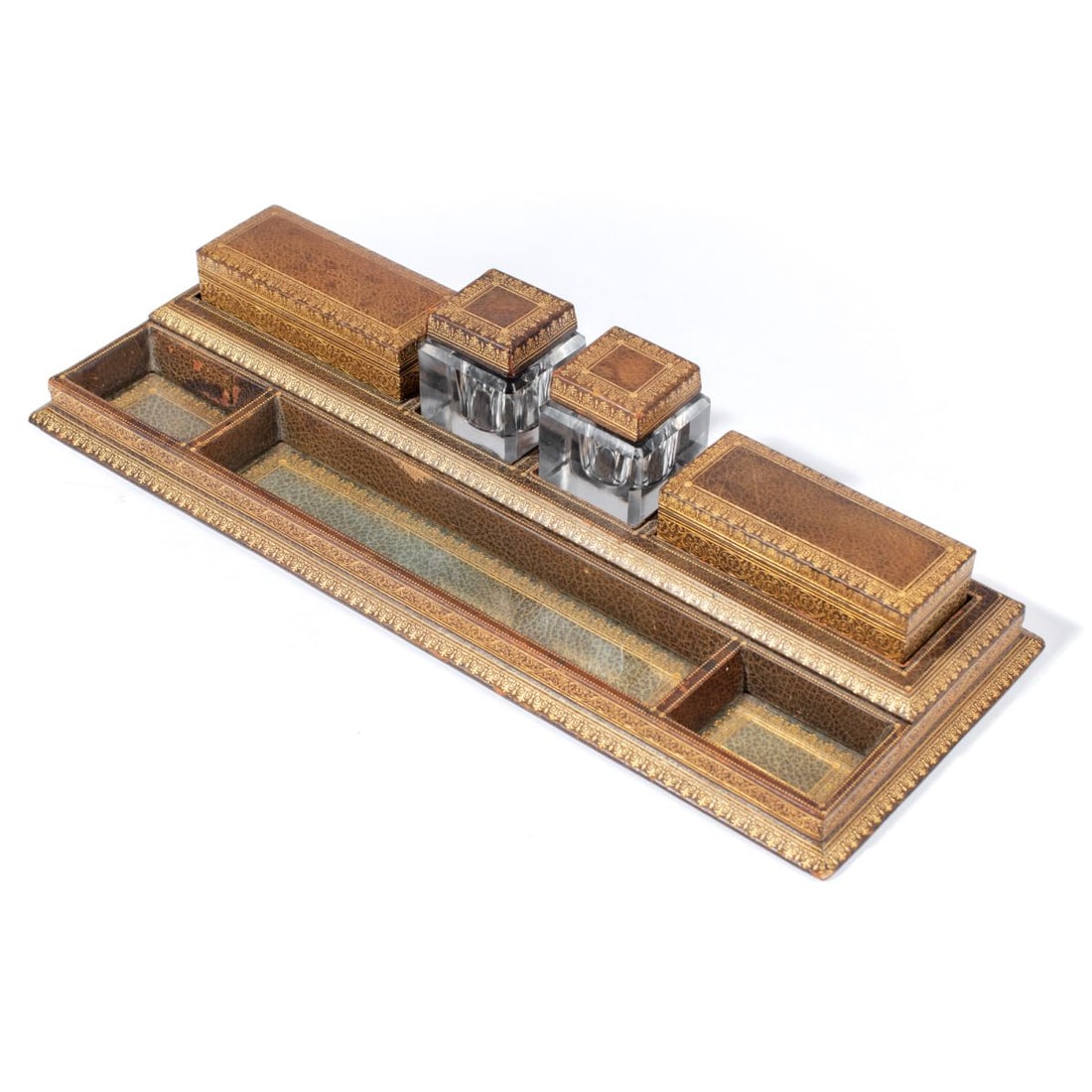 Antique Italian Florentine Leather Desk Set: Antique Italian Florentine 5-piece gilt embossed leather inkwell desk set. Includes pair cut glass inkwells, stamp box with hinged lid, box with lid, and fitted base. Marked FLORENTINE LEATHER & LINEN