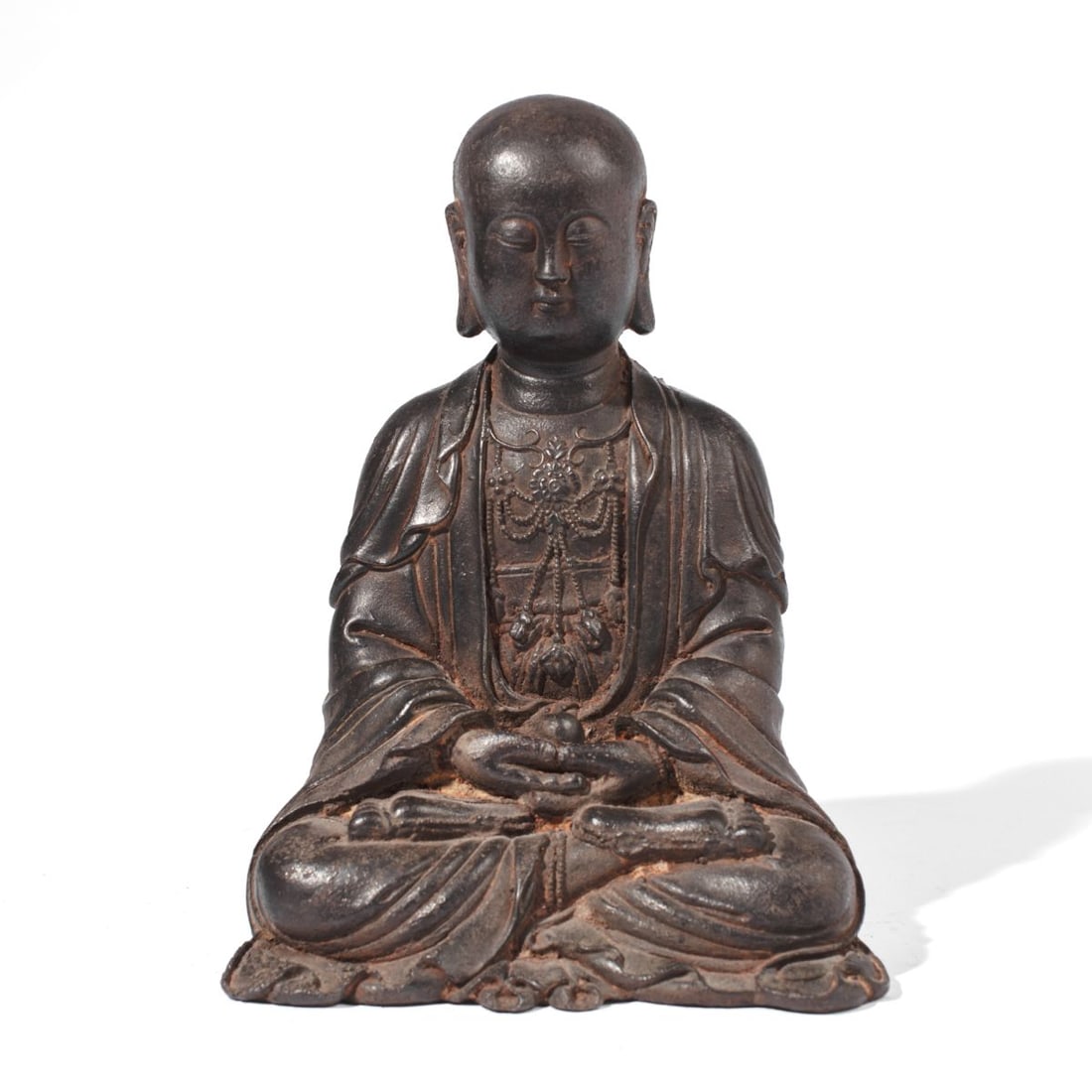 Chinese Cast Iron Buddhist Luohan Figure: Chinese cast iron alloy figure of a Luohan with elaborate necklace in relief and holding pearl. Some rust to folds; in very good overall condition. 10.5" H x 7" x 5".