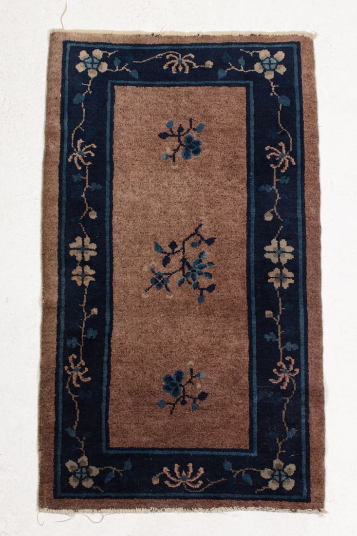Vintage Chinese Peking Scatter Rug: Vintage Chinese Peking Scatter Rug. Brown field with cobalt blue floral decorated border, blue floral prunus designs at center, Measures 46x26". Some slight fraying at fringe, overall good condition.